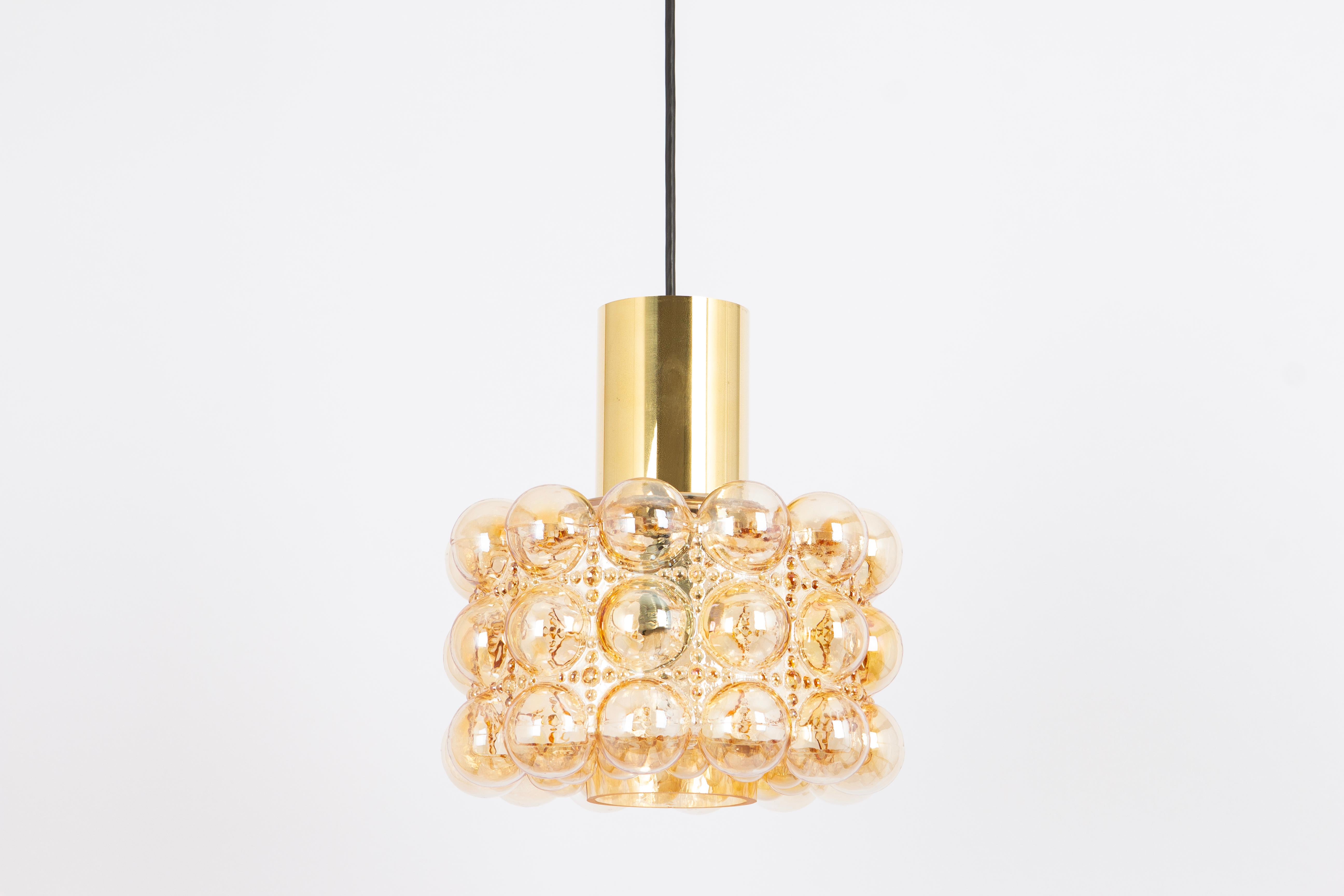 A large round with light smoke tone bubble glass pendant designed by Helena Tynell for Limburg, manufactured in Germany, circa 1970s

Sockets: It needs 1 x E27 standard bulb.
Light bulbs are not included. It is possible to install this fixture in