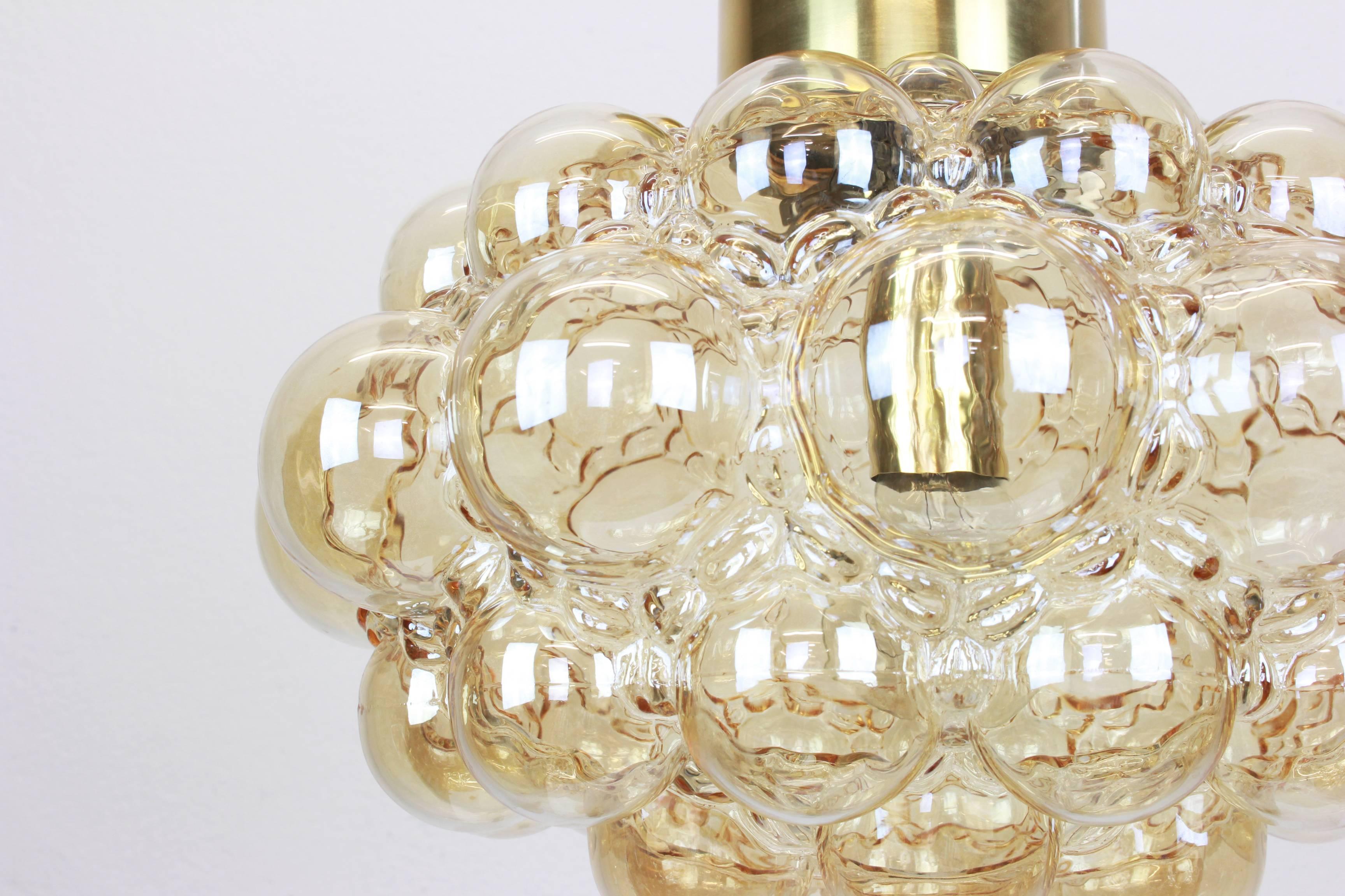 A large round smoke tone bubble glass pendant designed by Helena Tynell for Limburg, manufactured in Germany, circa 1970s.

Sockets: needs 1 x E27 standard bulb with 100W max each and compatible with the US/UK/ etc standards
Drop rod can be