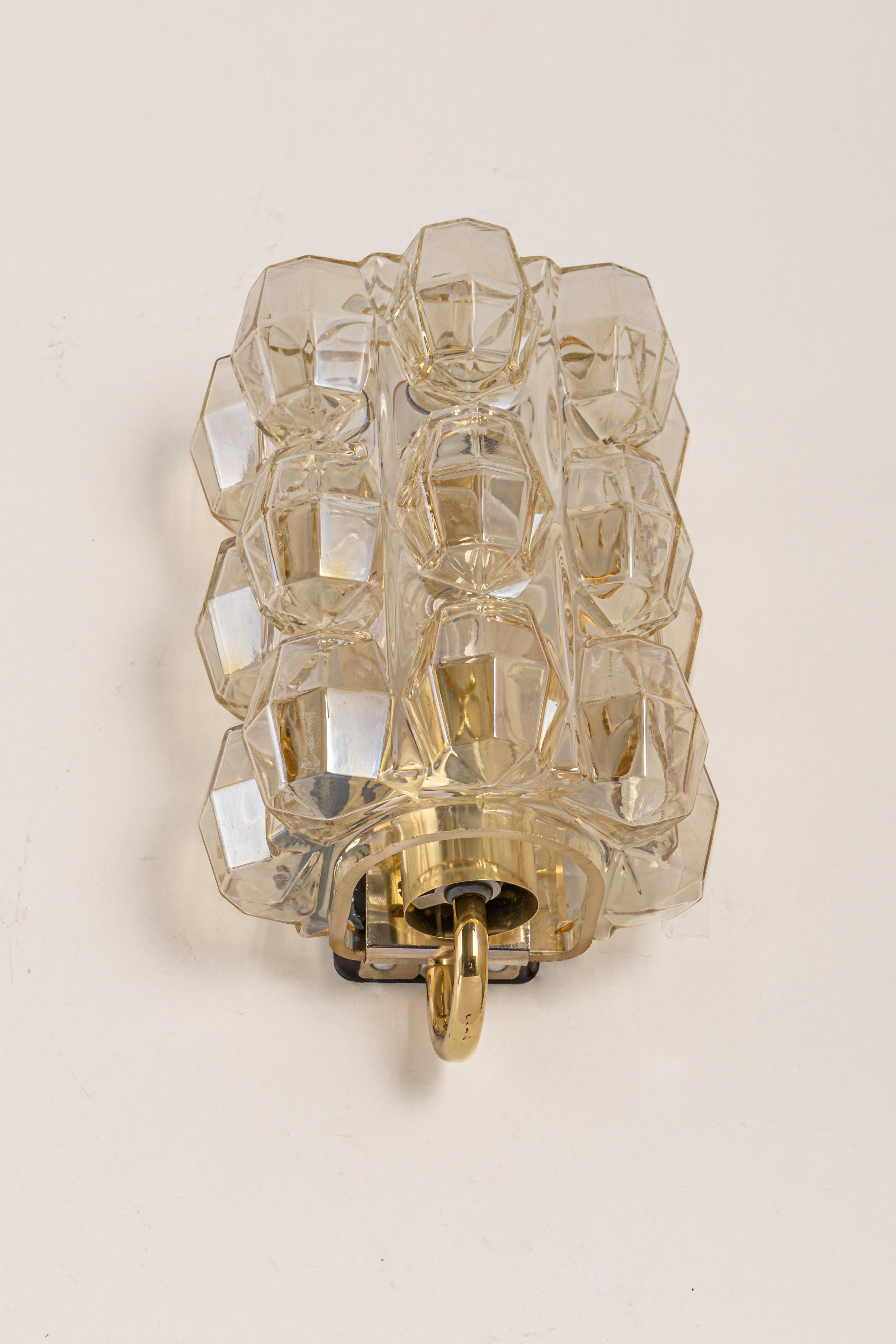 Wonderful large golden wall light, from Limburg Glashütte, Germany, circa 1960-1970. Smoked bubble glass on a golden brass base.

Heavy quality and in very good condition. Cleaned, well-wired, and ready to use. 
The fixture requires 1 x E27