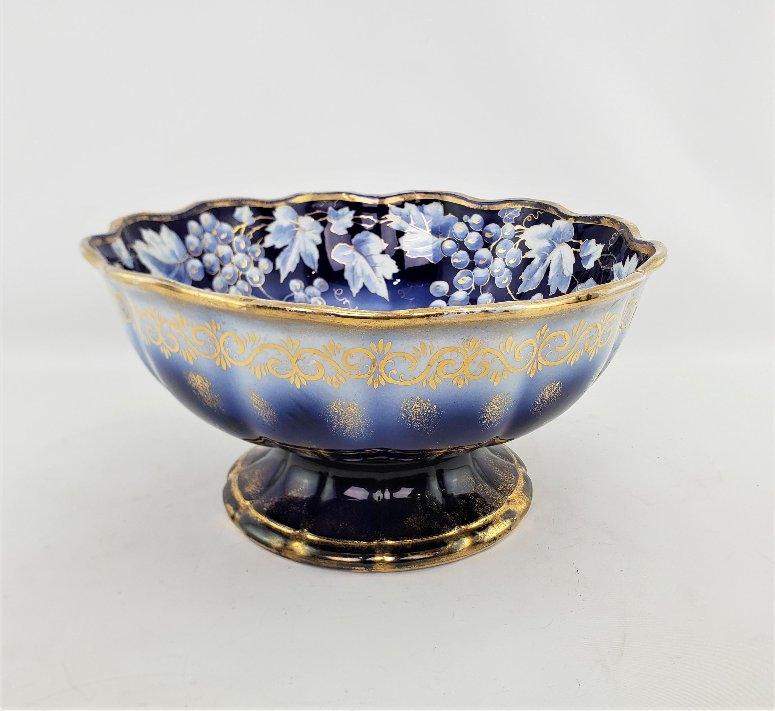 This very large antique bowl was made by the American China Company of the United States and dates to approximately 1880 and done in a period Victorian style. The bowl is ceramic, or semi-porcelain as marked on the base, and is glazed with a cream