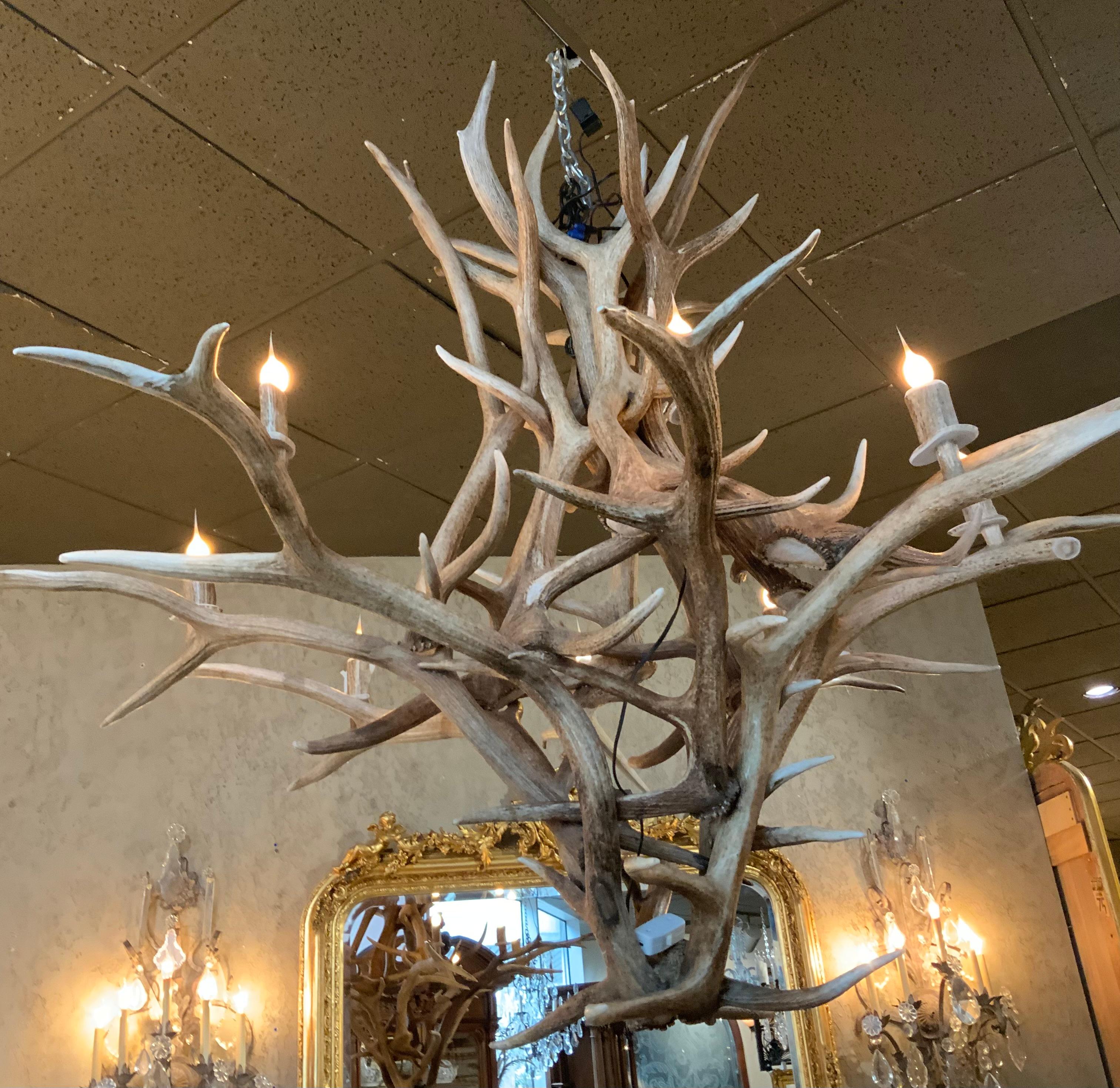 This is a very handsome and large piece. Note the size!
It is great for a large room with a high ceiling. The rustic
Quality of this chandelier makes it desirable for a ranch
Or informal room. It is in great condition without any wiring 
Issues, it