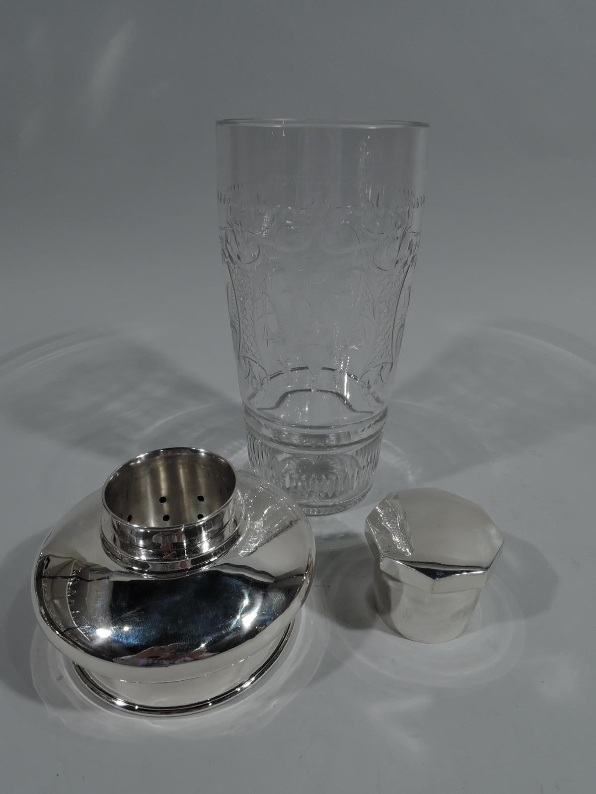 Large American Modern sterling silver and glass cocktail Shaker. Made by Erskine V. Van Houten in White Plains, New York, circa 1940. Glass cup with straight and tapering sides with etched stylized ornament: strapwork cartouches alternating with