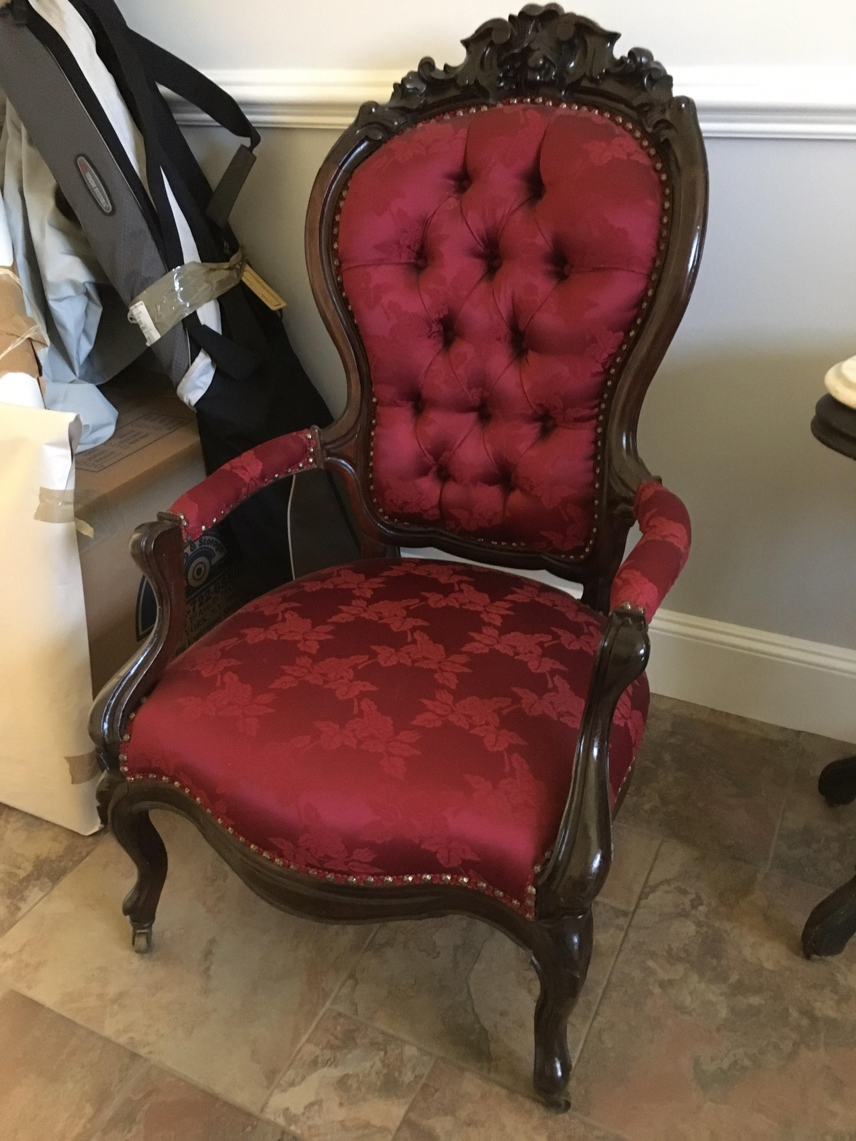 Large American Rococo Revival rosewood parlor armchair, mid-19th century high quality carving and detail. Original casters. Frame is in fair condition. Show well but has old repairs and shrinkage cracks on seams. Fine quality recent reupholstery.
 