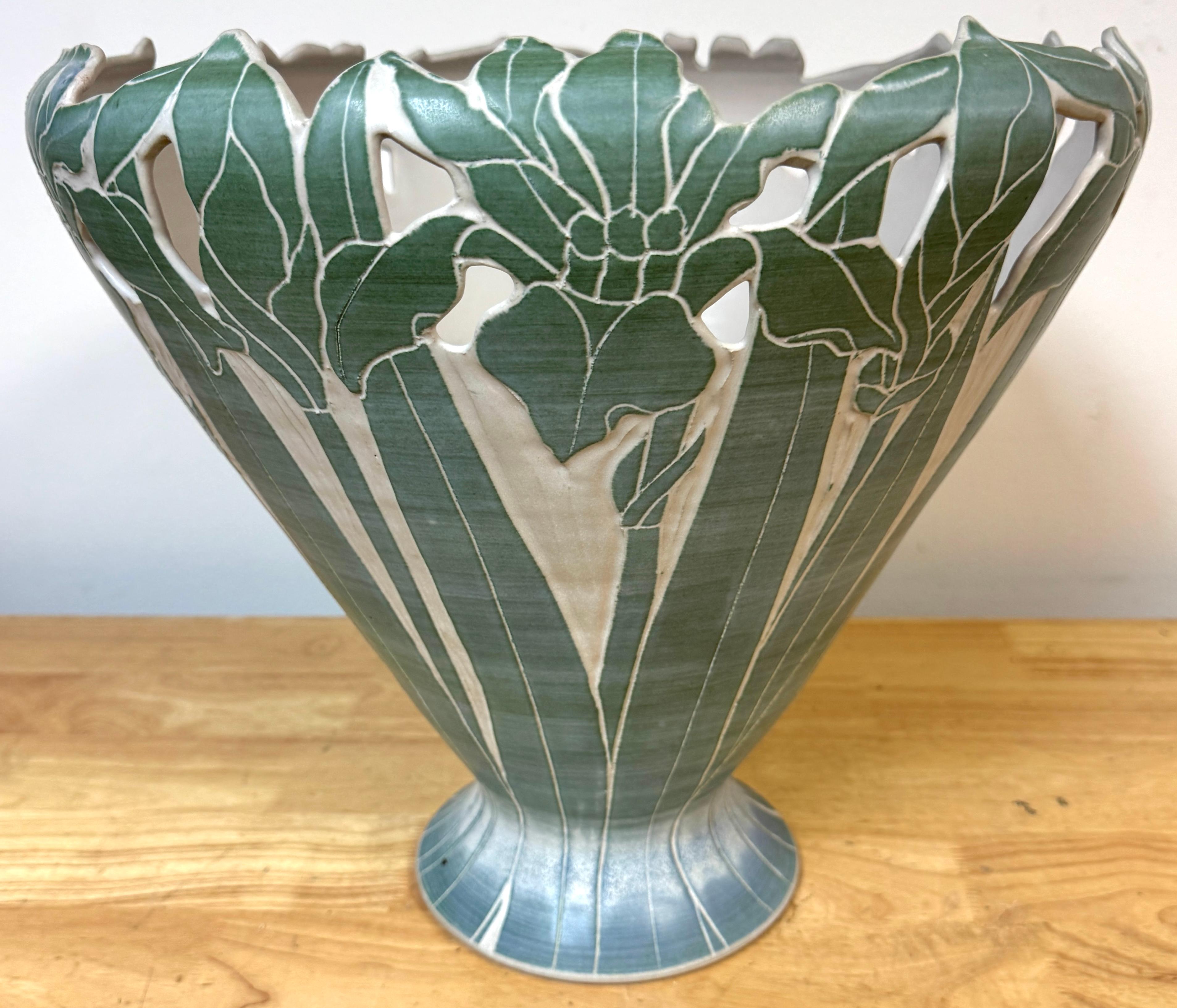 Large American Studio Pottery Vase with Iris Motif, in the Style of Newcomb College, Signed, Late 20th Century

A striking and masterfully crafted American studio pottery vase, boldly scaled and richly detailed, evoking the stylistic and decorative