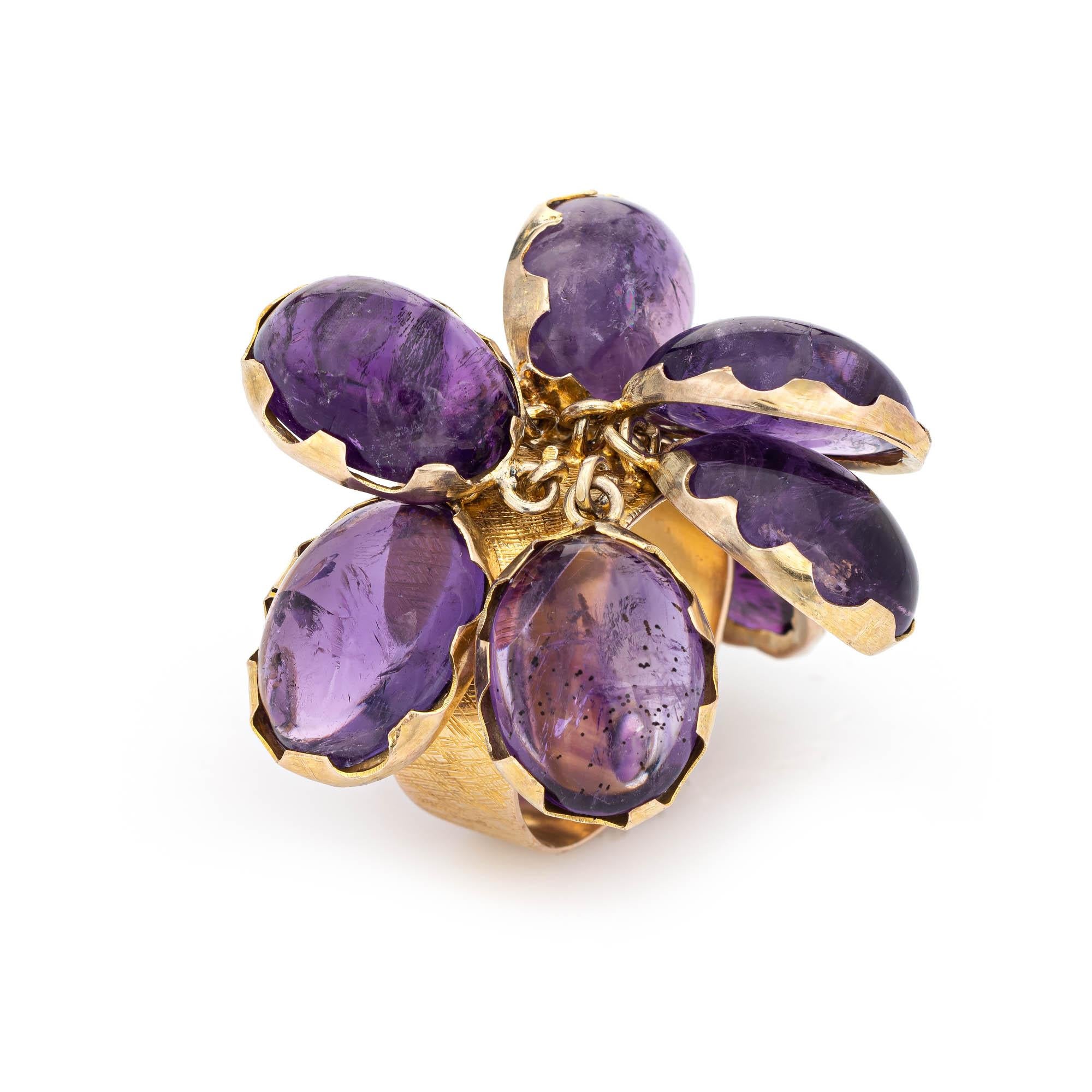 Fun and funky vintage charm ring (circa 1950s to 1960s), crafted in 14 karat yellow gold. 

Amethyst cabochons measure 13mm x 10mm (estimated at 5 carats each - 40 carats total estimated weight). The amethysts are in excellent condition and free of