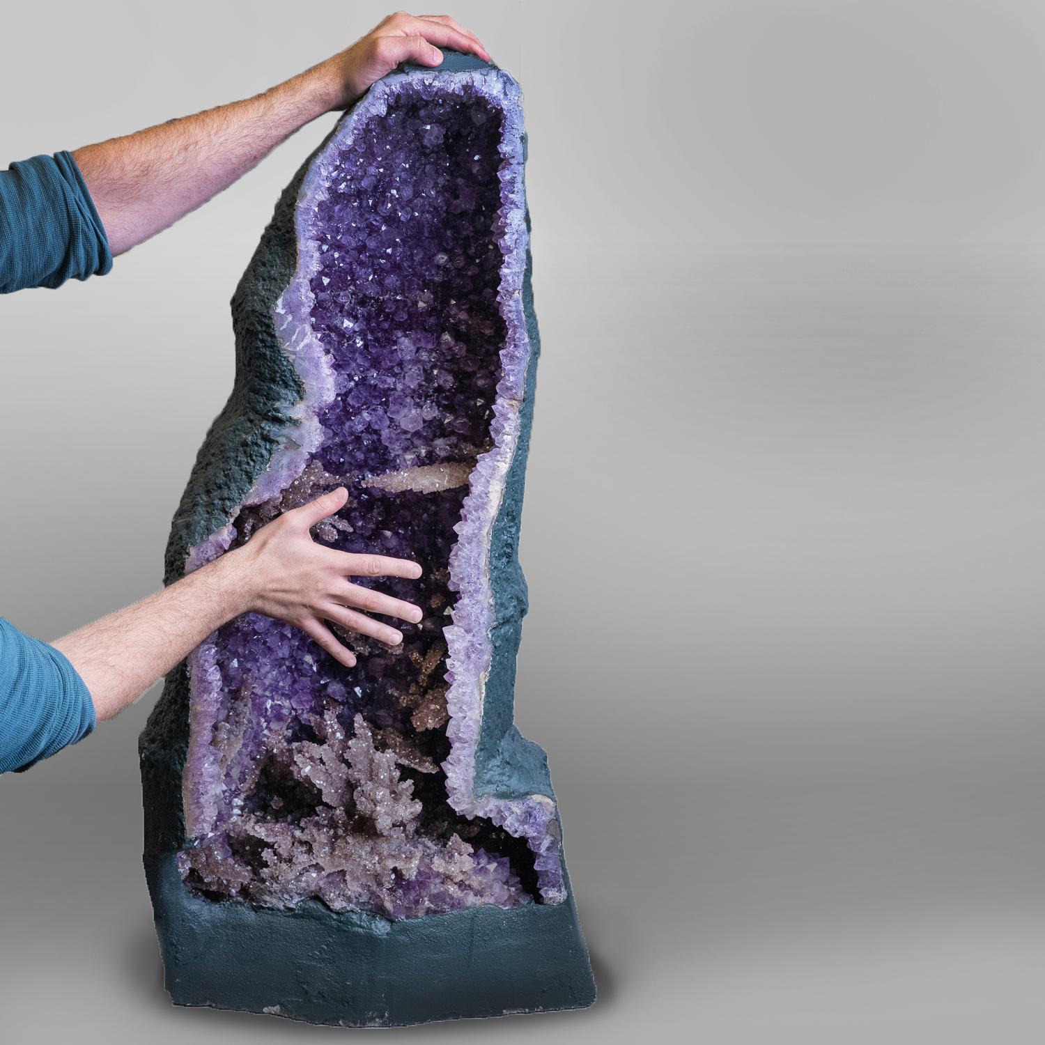 AAA Top-quality Brazilian Amethyst clustered geode with druzy quartz crystals. This specimen is lined with large lustrous crystallized gems, transparent to translucent amethyst variety quartz crystals - with deep grape purple color and highly