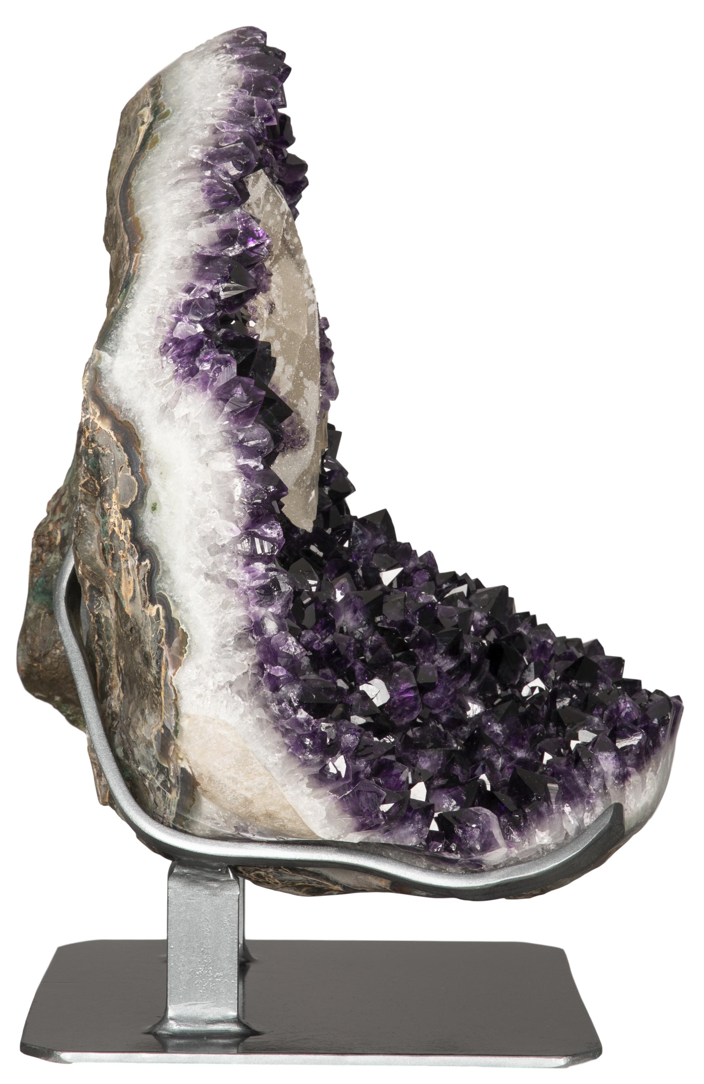 A breath-taking large amethyst cluster, with an incredible amethyst-overlaid calcite formation at the top. 

This formation is unusual for its overall scale and the extremely high quality of its intense violet amethyst crystals. Furthermore, the