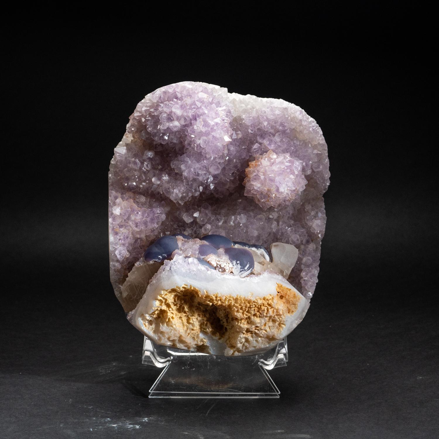 Museum quality, rare undulating formation of a gemmy transparent amethyst cluster with a cluster of spherical purple fluorite. These amethyst crystals are fully terminated, with a bright gradient color of purple to a deep grape purple color. The