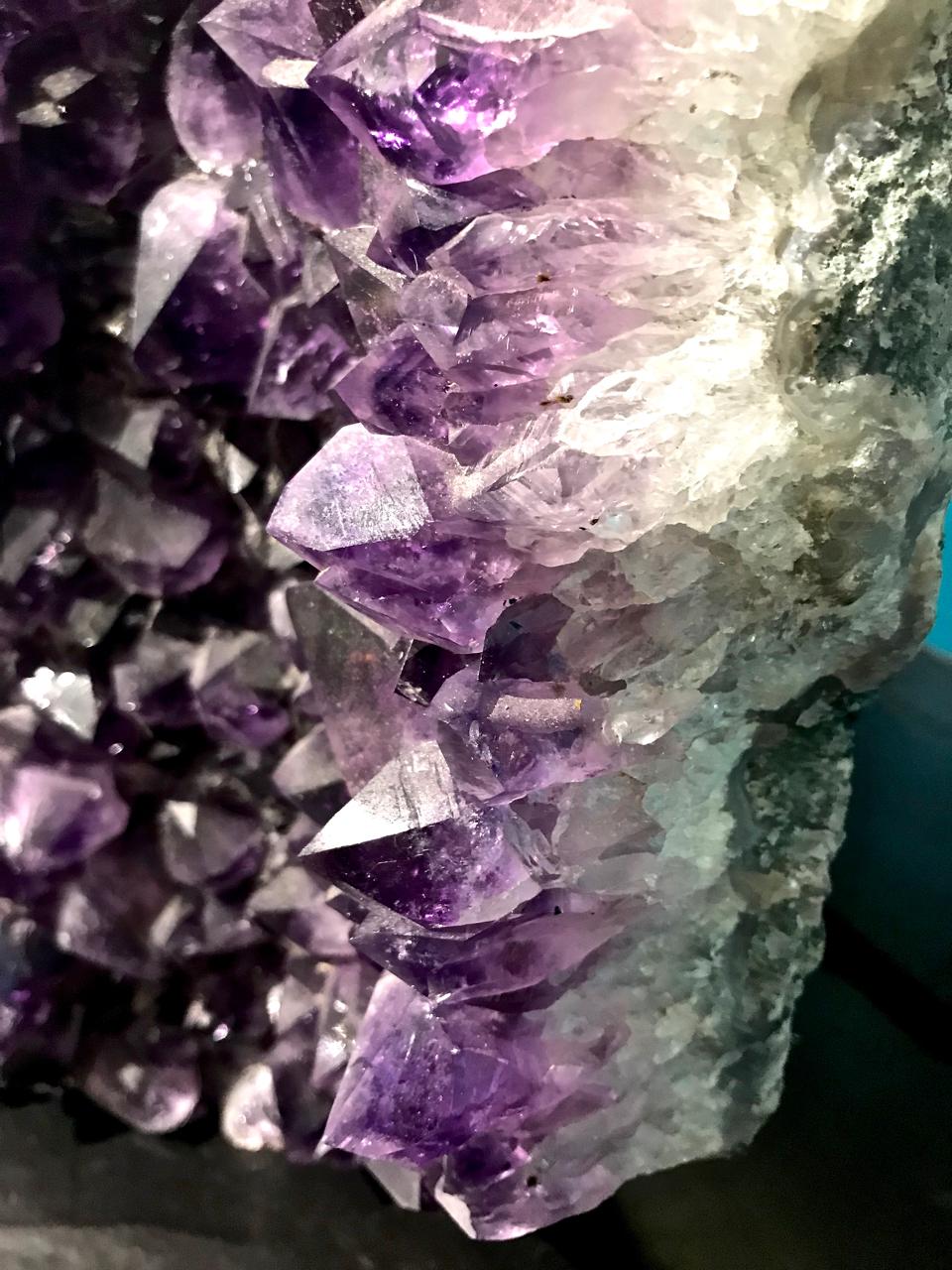 This is a stunning double or twin geode revealing beautifully colored and large amethyst crystal with wonderful points encased by rock crystal. The double or twinned geode formation is unusual.