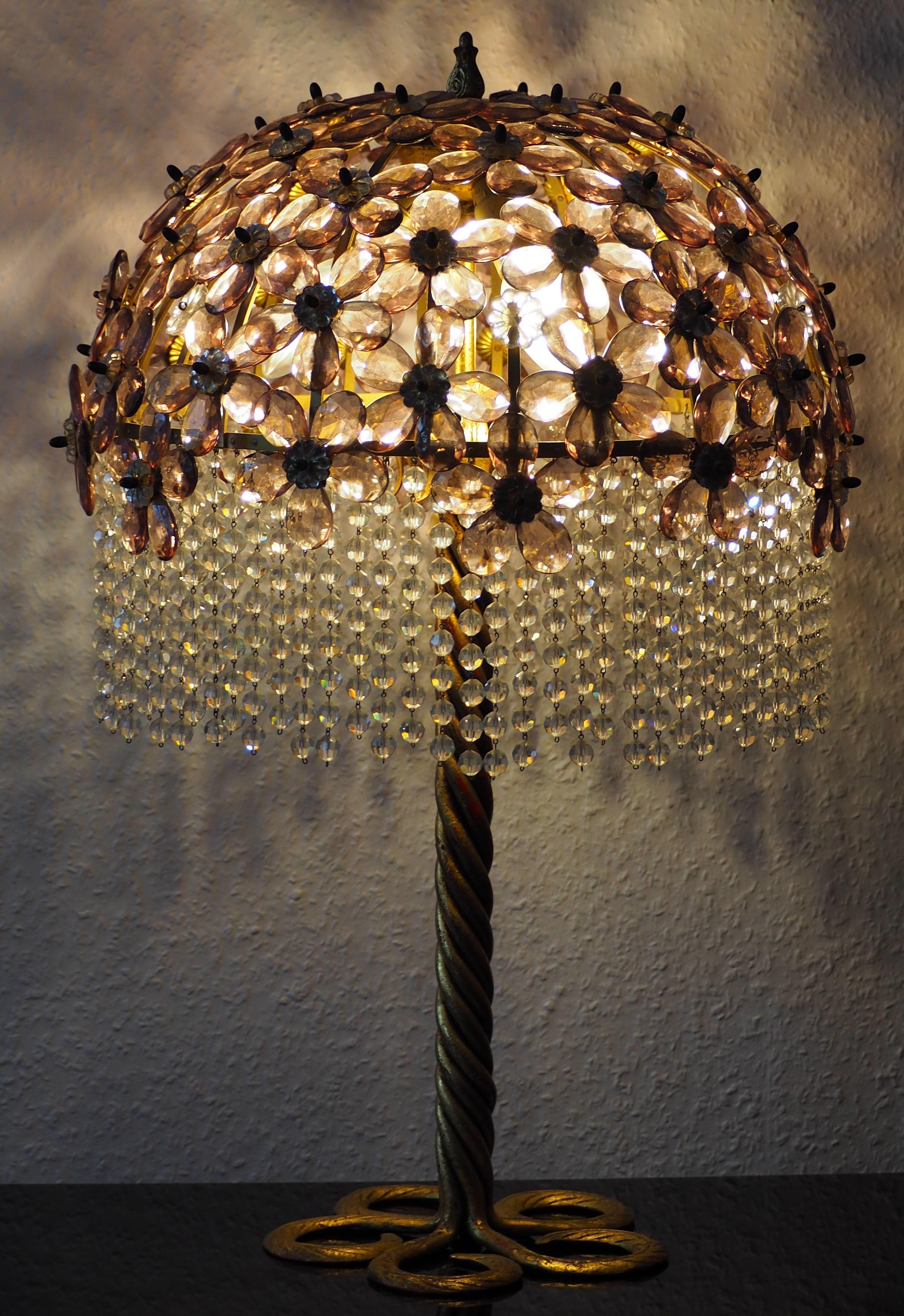 Beautiful, large table lamp on solid gilt iron foot and amethyst glass shade, Italy, circa 1970s.
Socket: 3 x E14 for standard screw bulbs.



   