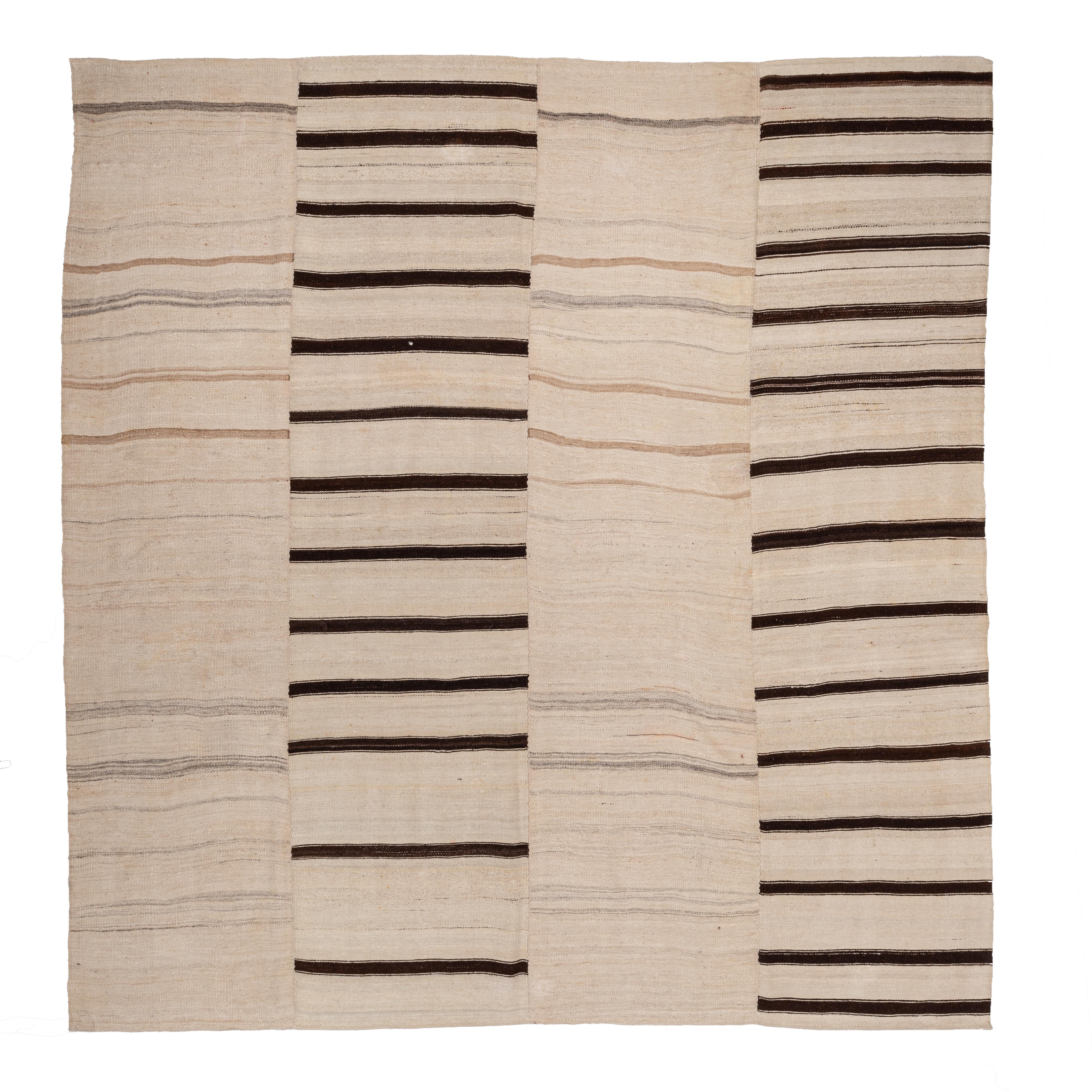 
These kilims from Konya region of Central Turkey  are flat-woven rugs made from high-quality sheep's wool in the Konya region of Turkey. These neutral-colored kilims feature mostly plain striped designs and used for everyday life from a cover for