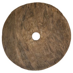 Large Ancient Cart Wheel with Rustic Character and Time-Worn Appearance