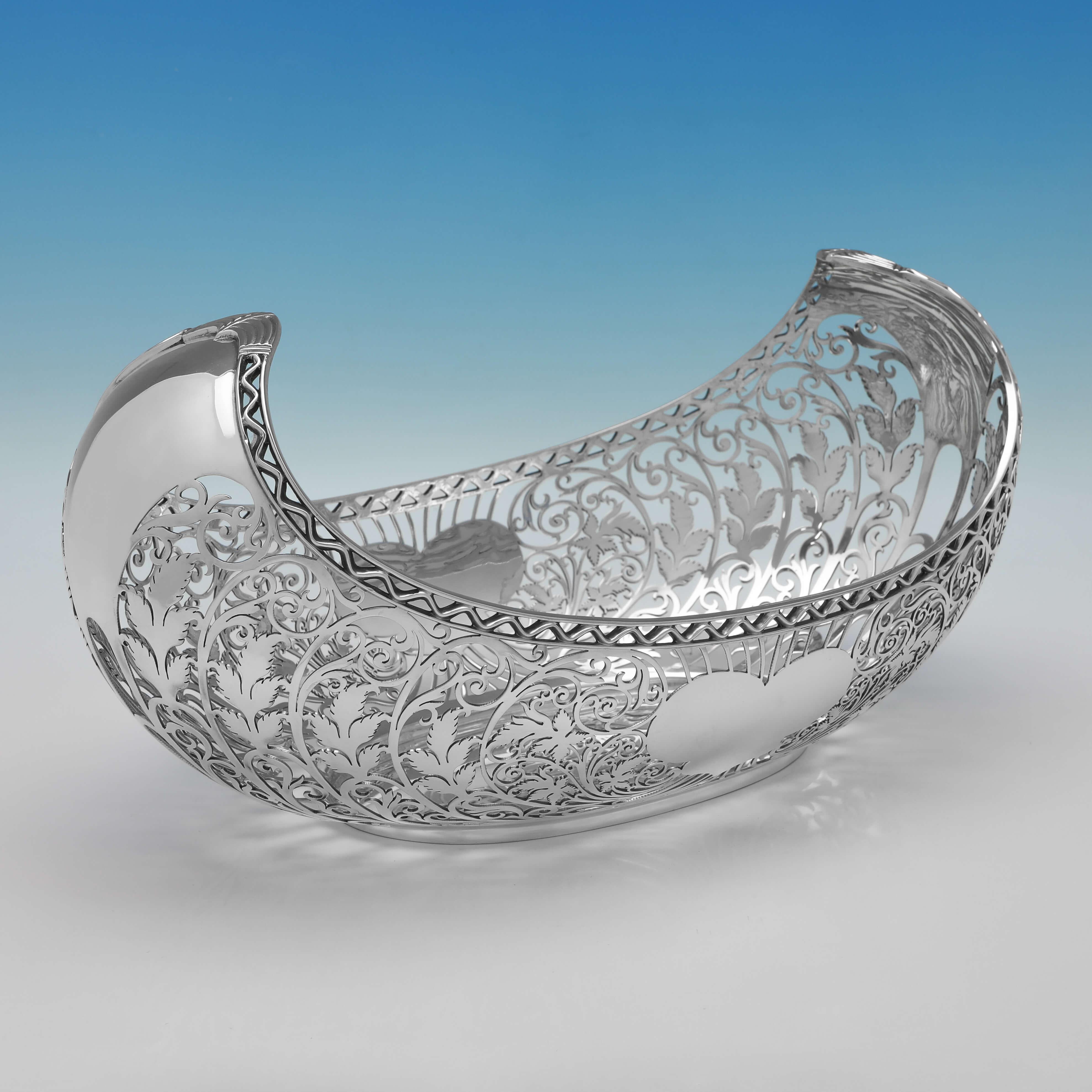 Hallmarked in Sheffield in 1919 (maker unknown but registered in both Sheffield and Birmingham), this striking, Antique Sterling Silver Dish, features pierced detailing throughout and heart shaped cartouches. 

The dish measures 7.5