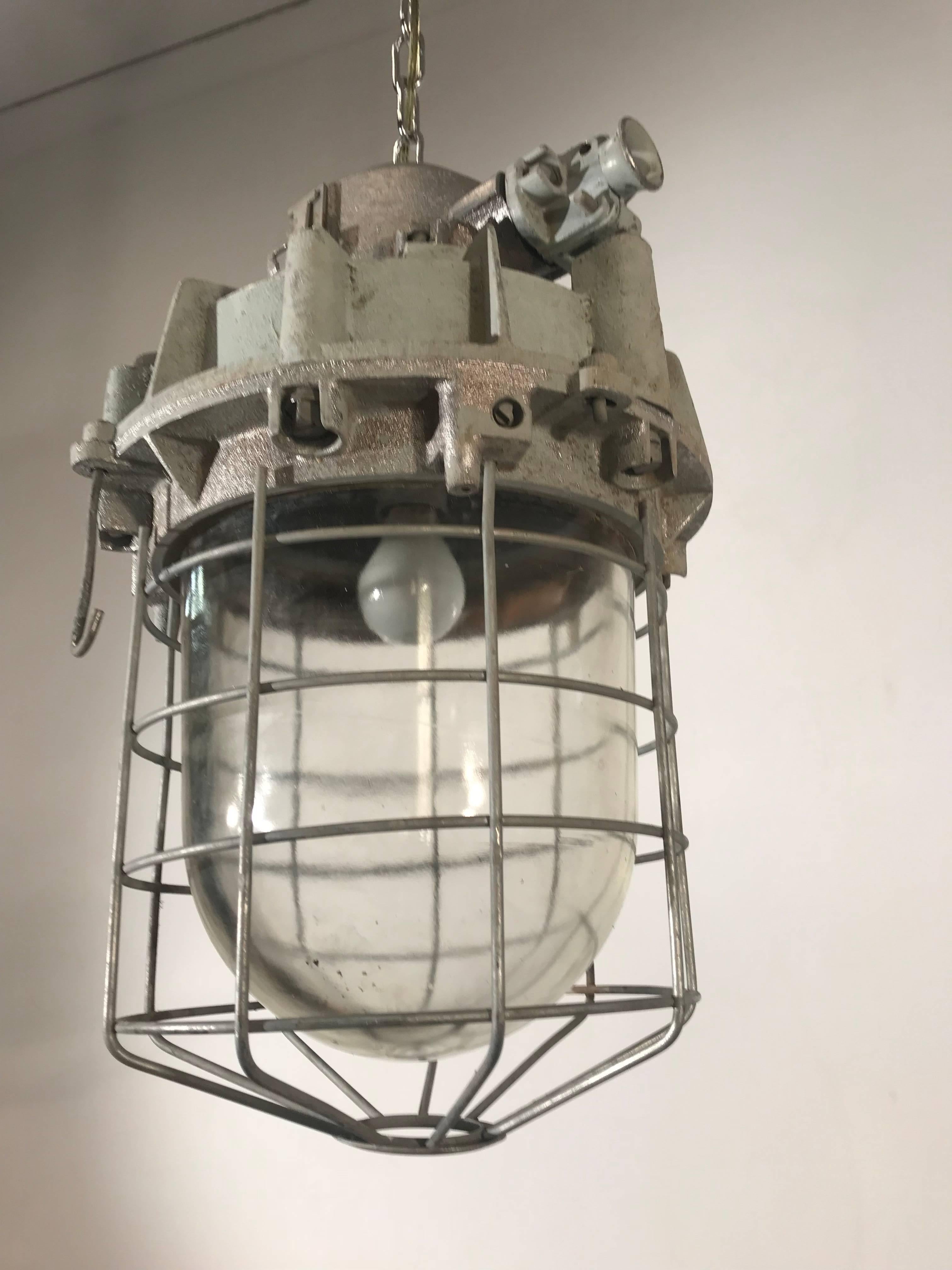Original, heavy duty industrial factory lamp. 

This large and cool Industrial pendant with its original glass shade will look wonderful over a kitchen island, but there are many other spaces and places where this good looking and authentic fixture