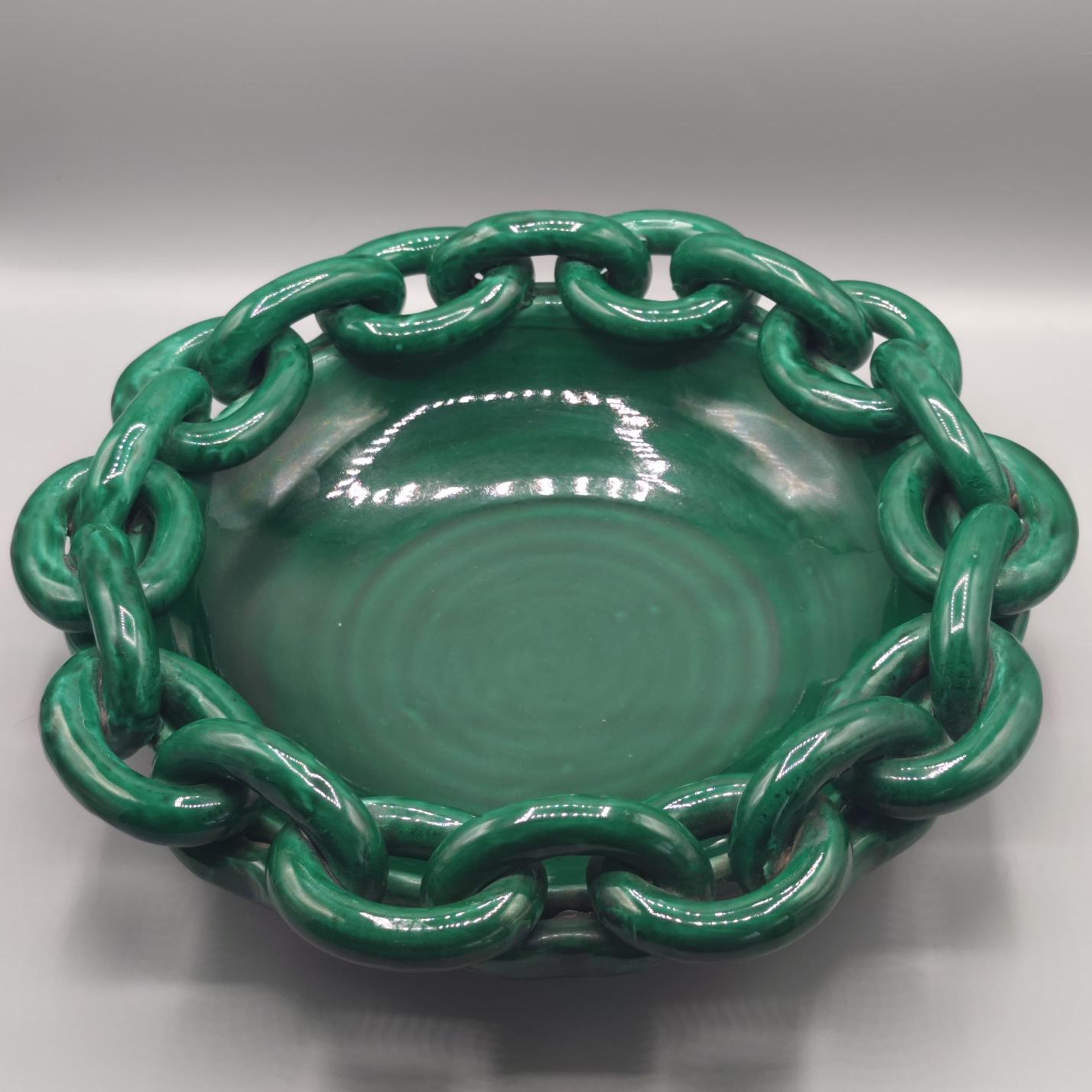 Large round ornemental fruit bowl. 
Green glazed ceramic bowl, the edge decorated with a thick link design. 
Jean François Daniel, Vallauris 
circa 1950
 signed 