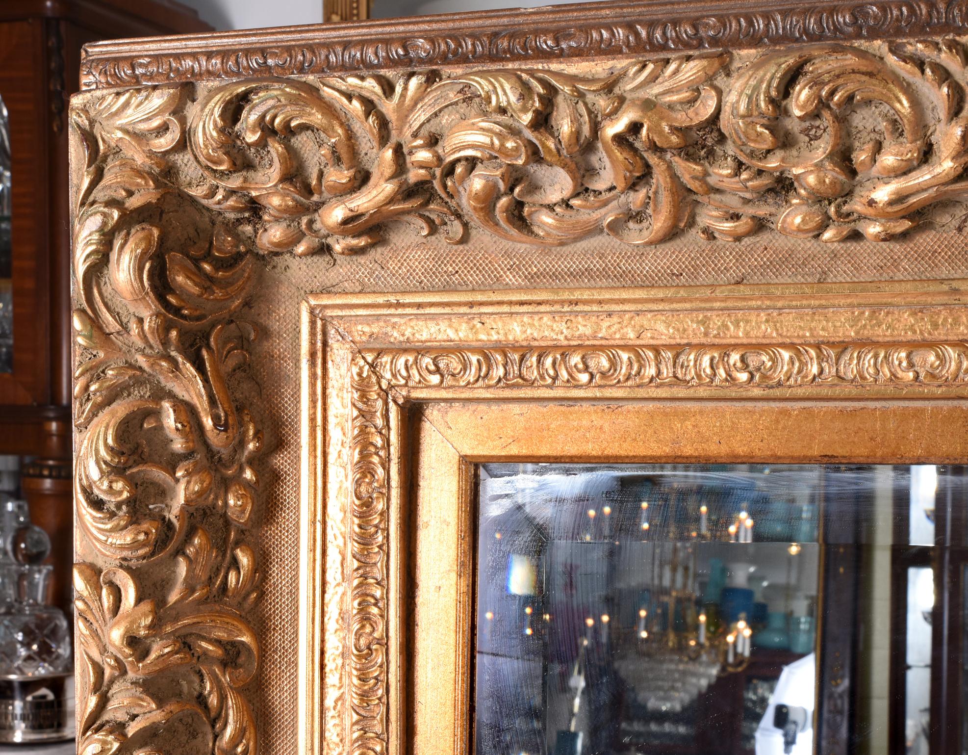 Large and elegant beveled giltwood frame fire mantel (fireplace) hanging wall mirror. This large beveled mirror is just beautiful and in excellent condition. The mirror measure about 62 inches length x 50 inches width x 4.5 inches deep.

 
