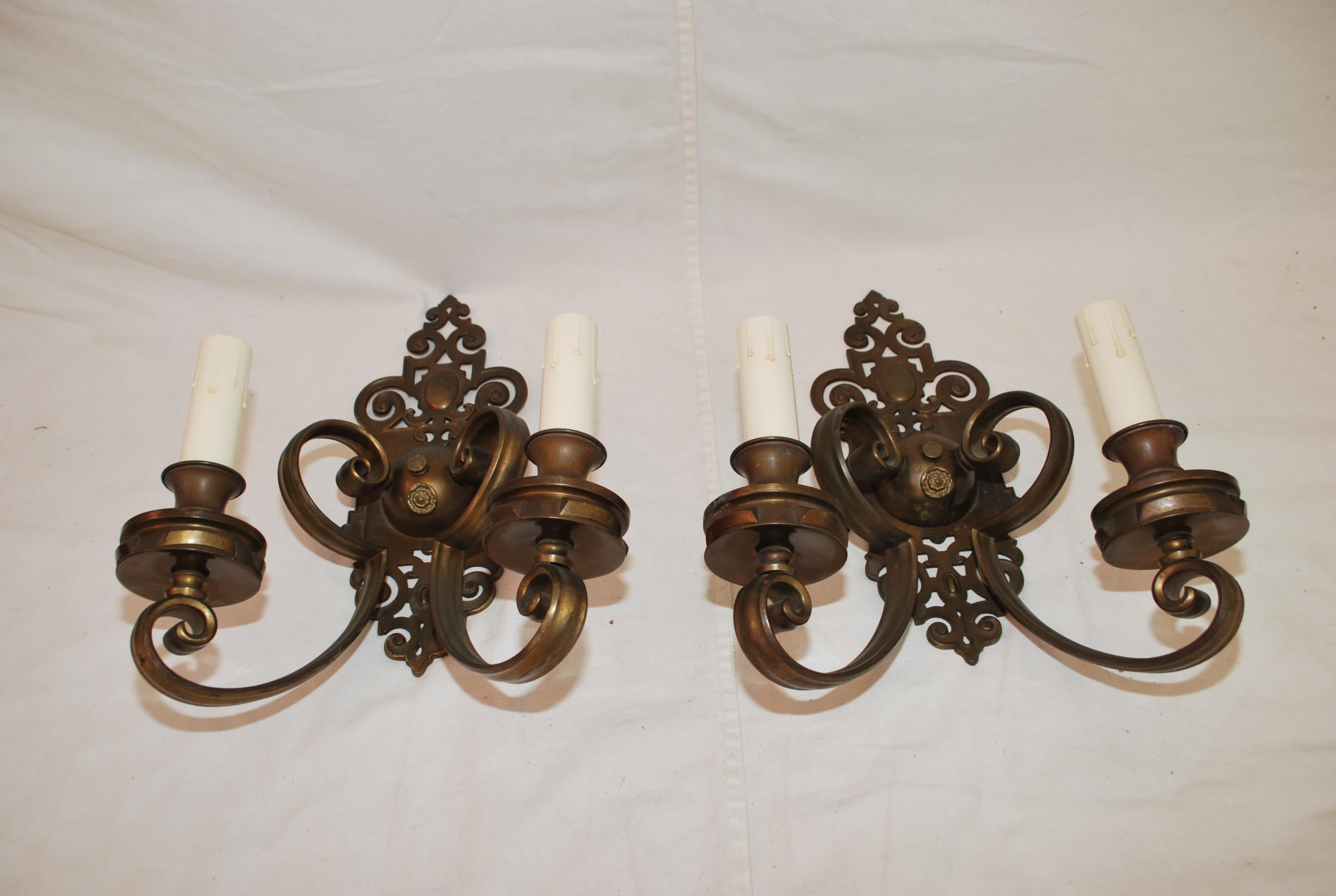 A beautiful and large pair of 1920's brass sconces, the patina is so much nicer in person