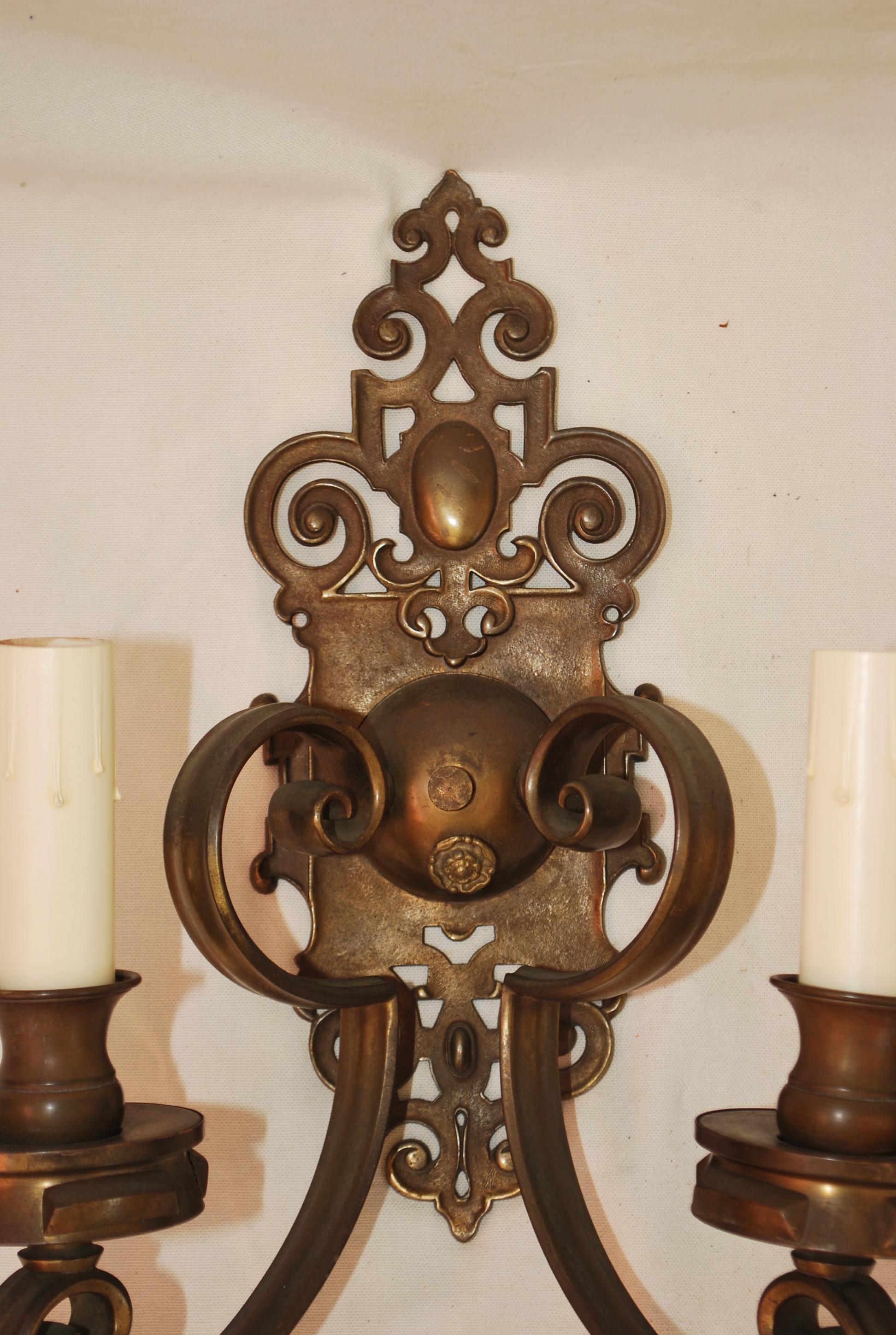 Brass Large and elegant pair of 1920's brass sconces For Sale