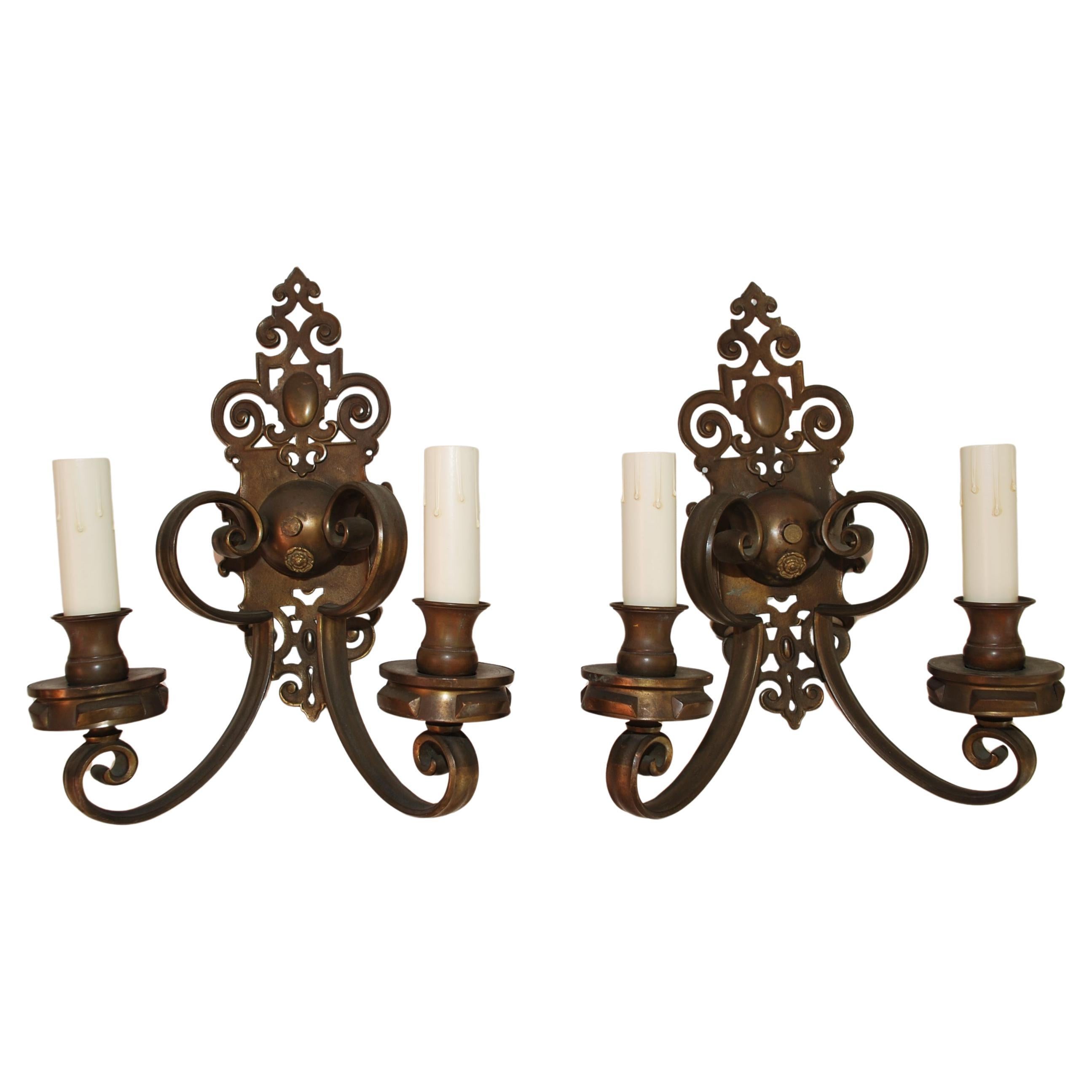 Large and elegant pair of 1920's brass sconces For Sale