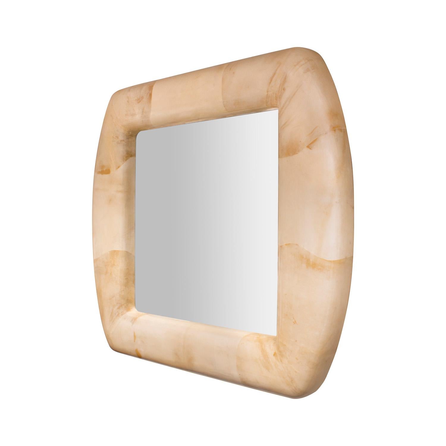 Beautifully crafted impressive mirror with frame in lacquered goatskin by Enrique Garcez, Colombia 1988 (original label dated on back). The gently curved form and the scale of this mirror make it a standout. The coloration of the goatskin is superb.
