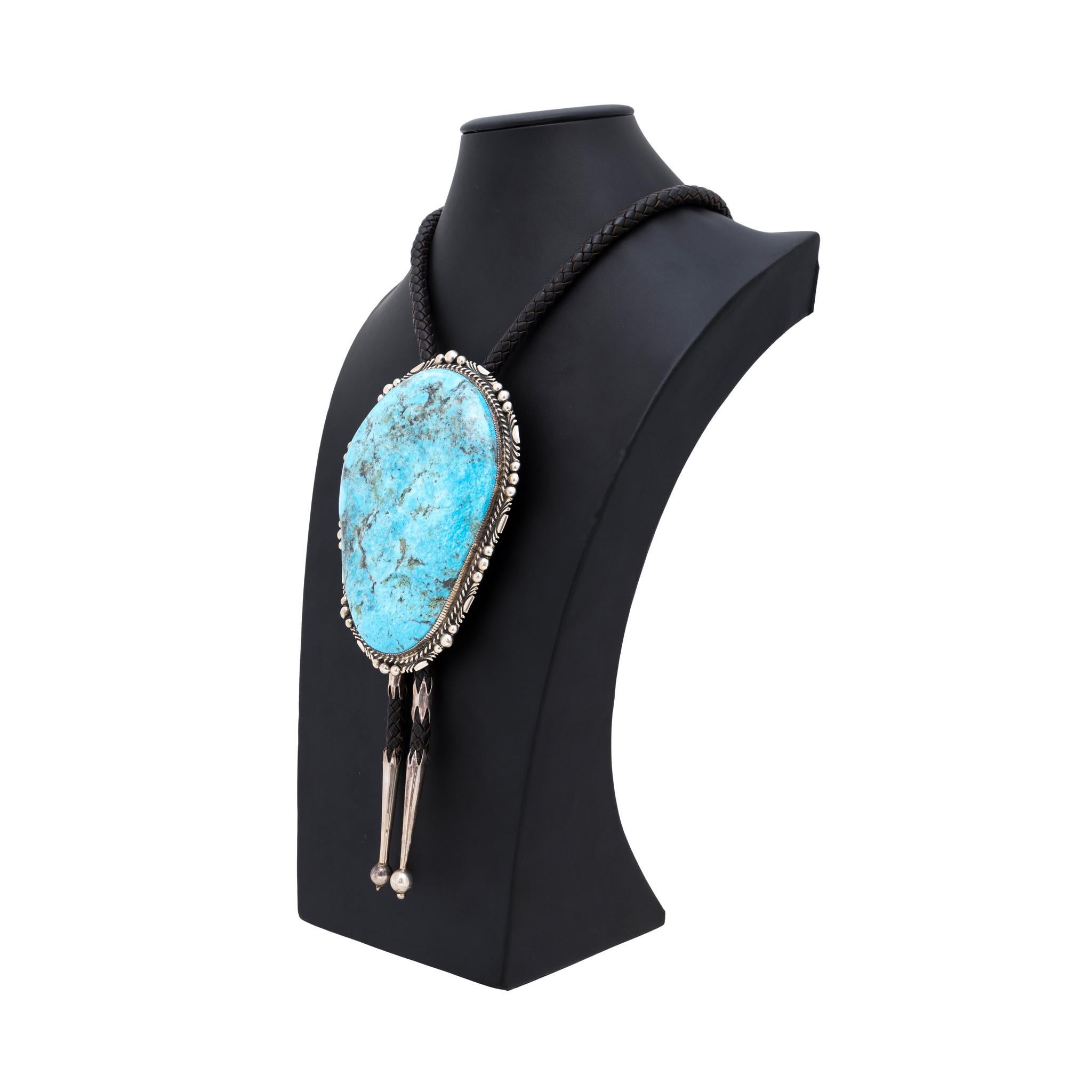 Exceptionally large Native American Navajo Indian Kingman turquoise and sterling silver bolo by Avin Joe. This piece is a show stopper! 1 inch thick, 6 inches long, 4 inches wide and a whopping 980 carat stone. Premium grade A natural, untreated