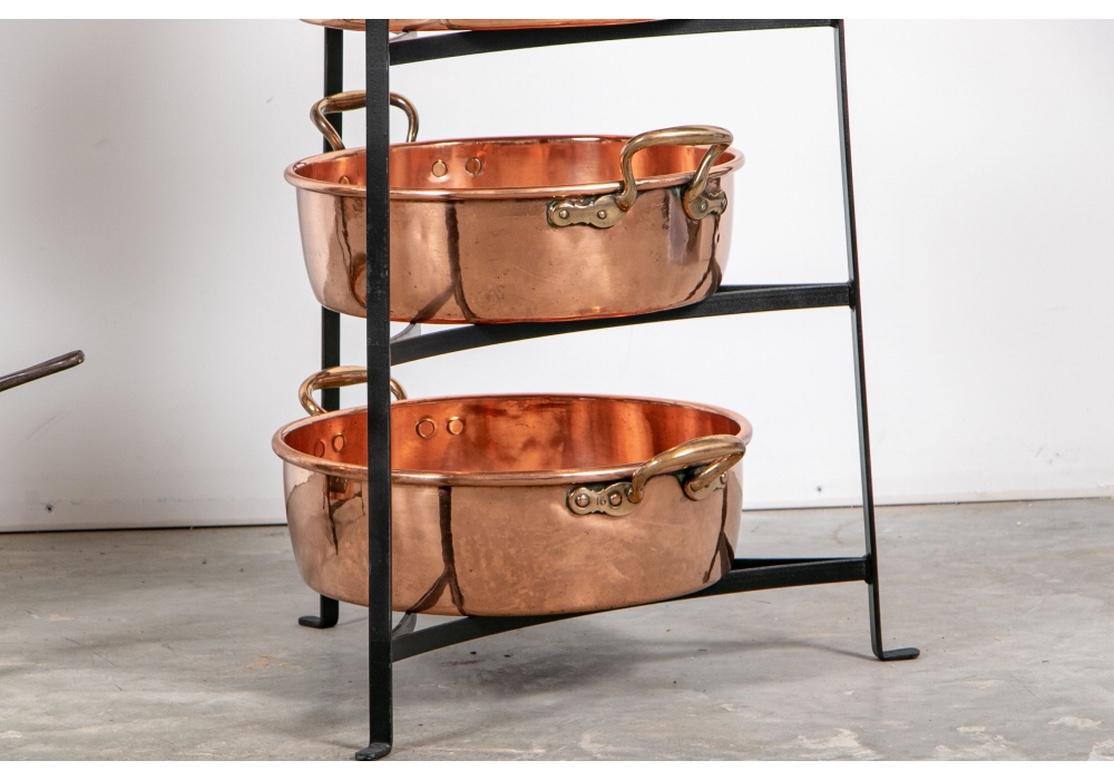 Rustic Large and Fine Collection of Antique Copper Cooking Vessels on Iron Étagères