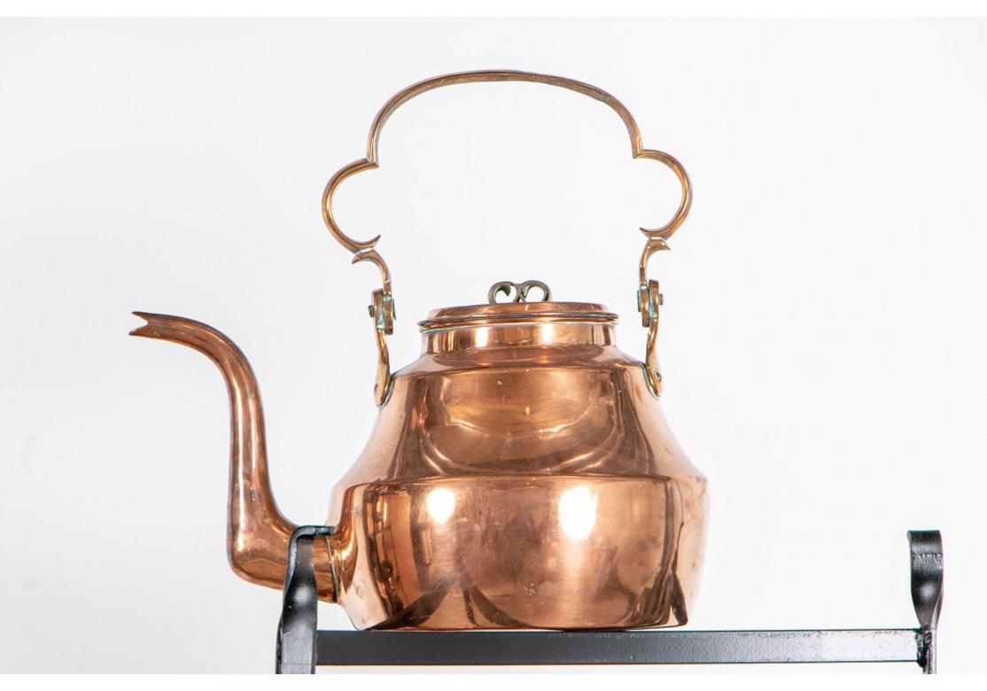 Large and Fine Collection of Antique Copper Cooking Vessels on Iron Étagères In Good Condition In Bridgeport, CT