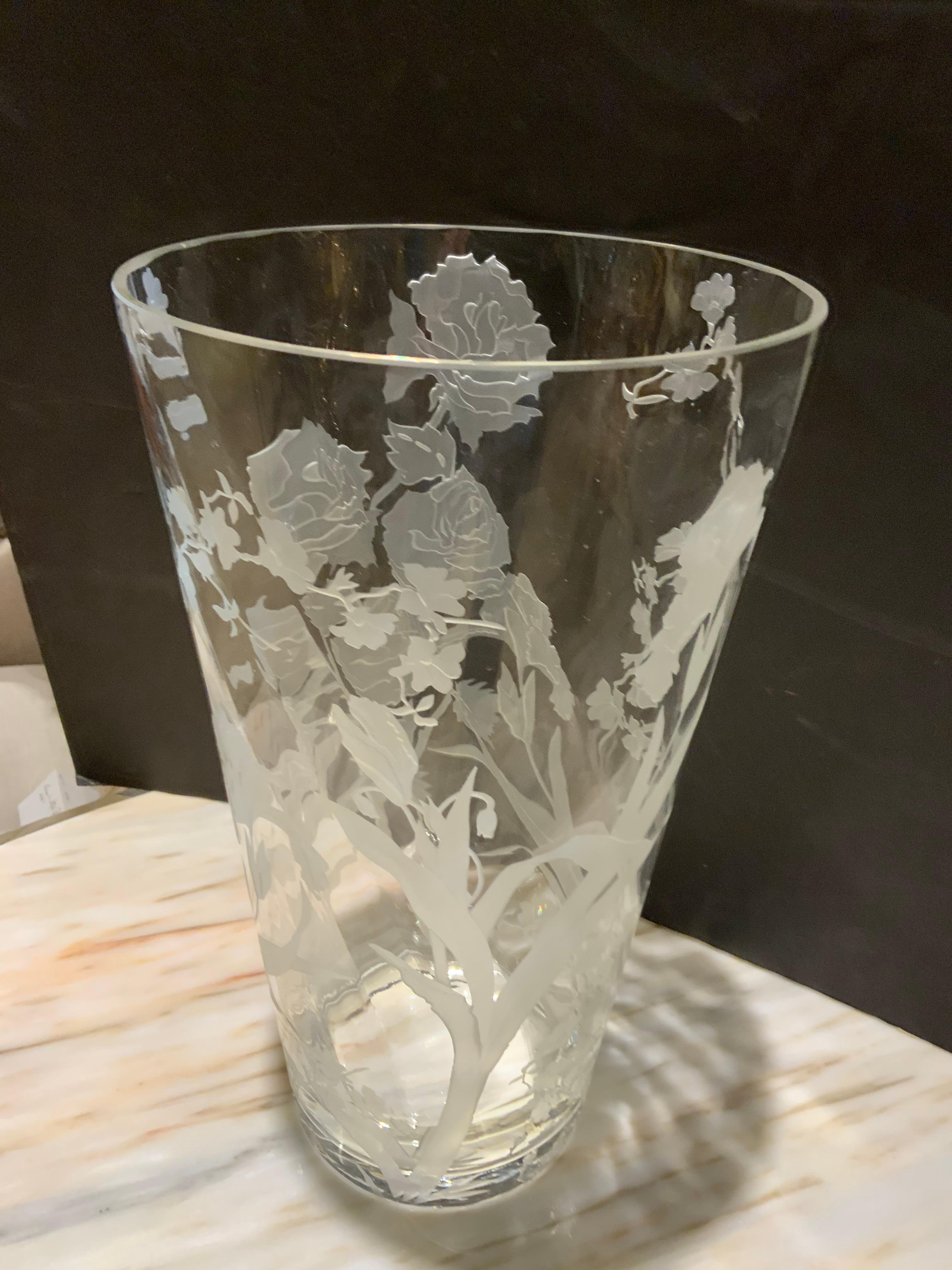 Large and exceptional crystal vase with etched floral and
Foliate designs around the entirety of this piece. The
Flowers are roses and irises. The vase is without chips
Or damage. Scrolling vines and flowers surround the
Full shape.