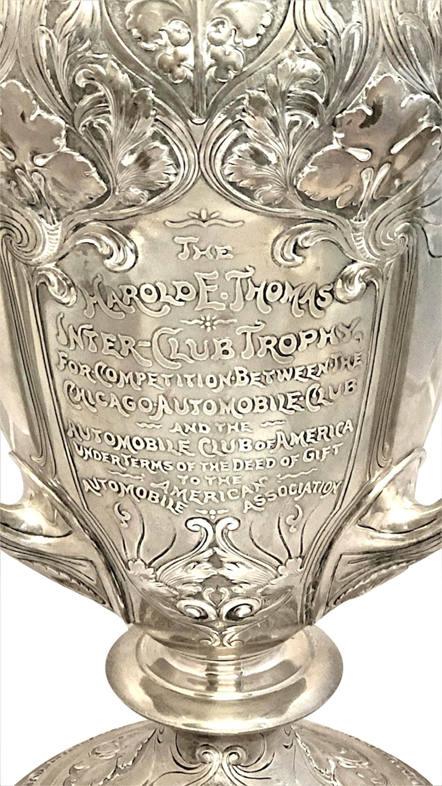 Circa 1905 Sterling Silver Specially made Gorham for Spaulding & Company Athenic,  three handled loving cup trophy, measuring 18 inches in height, 10 inches across the top and weighs 140 ounces. This piece is mostly all hand chased and fabricated