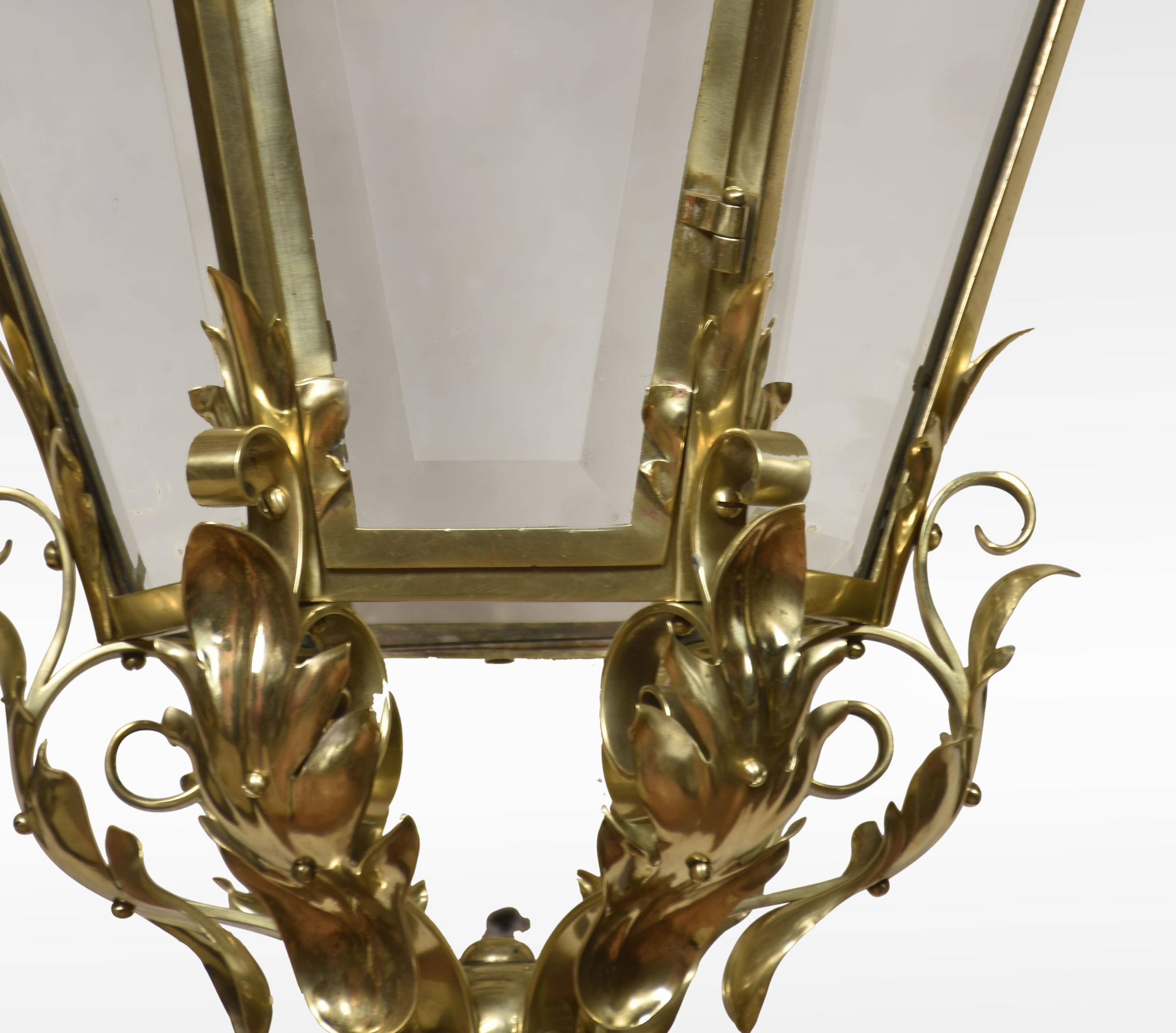 Large and imposing brass four-light lantern of hexagonal form the bevelled glass panels enclosed in frame with leaf crestings and scrolling detail. The central four lights have been rewired and tested.
Dimensions
Height 37.5 Inches
Width 20.5