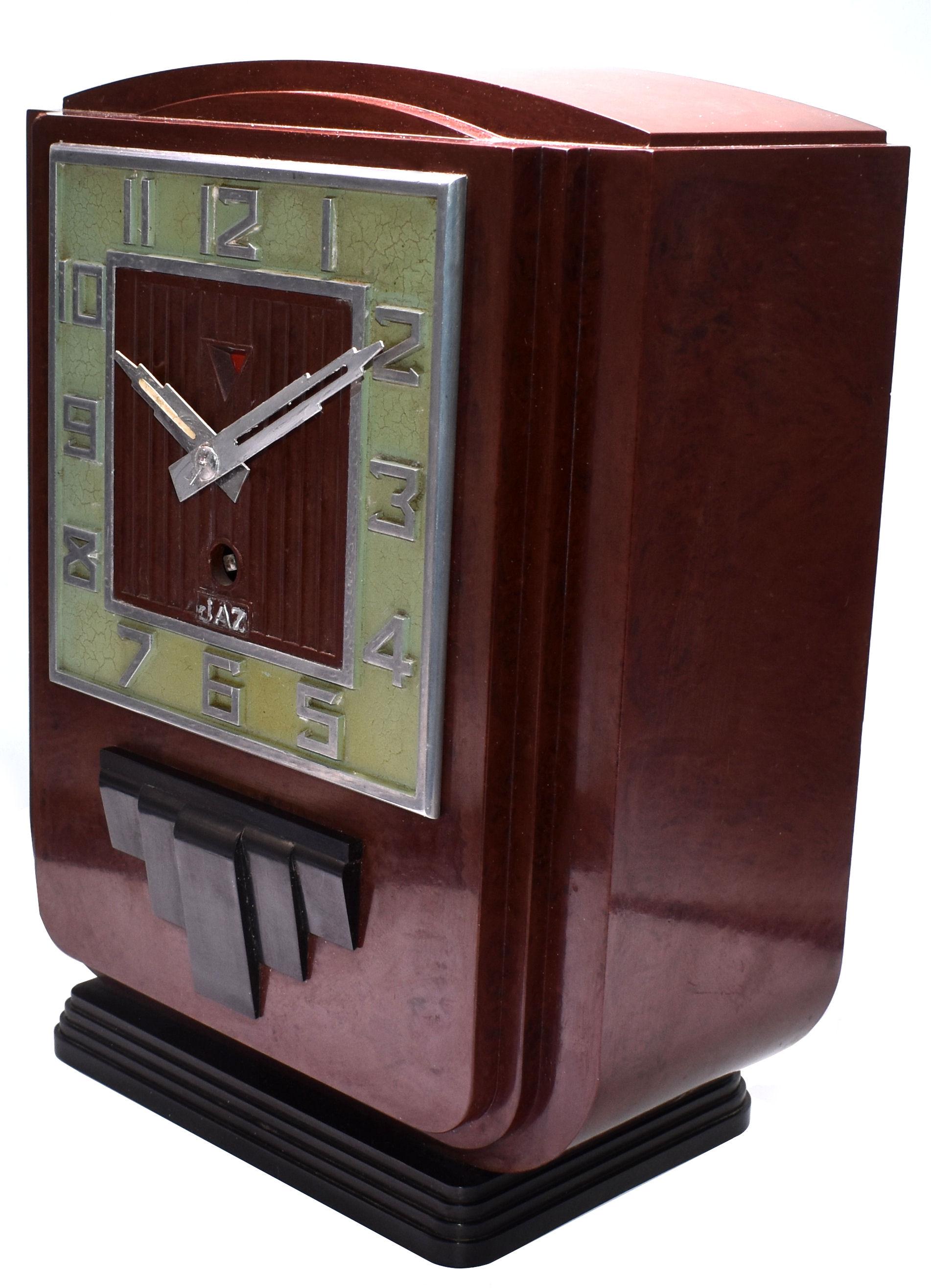 This is the daddy of true 1930s Art Deco clocks. Made in France by the very collectable JAZ Company, this clock screams everything about the Deco era we all love and admire, streamline, Industrial and modernist. The casing is a red mottled color,