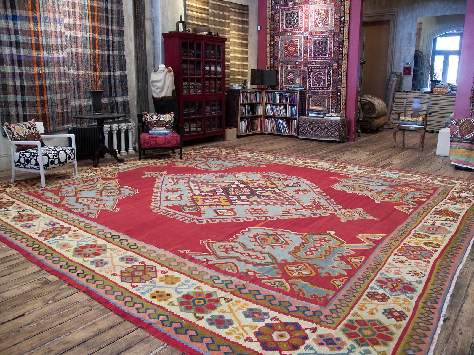 A very large antique kilim, woven in the Oushak region of Western Turkey, displaying the classic central medallion design and a dazzling color palette. Such kilims were contemporary with the many antique Oushak carpets woven at end of the 19th