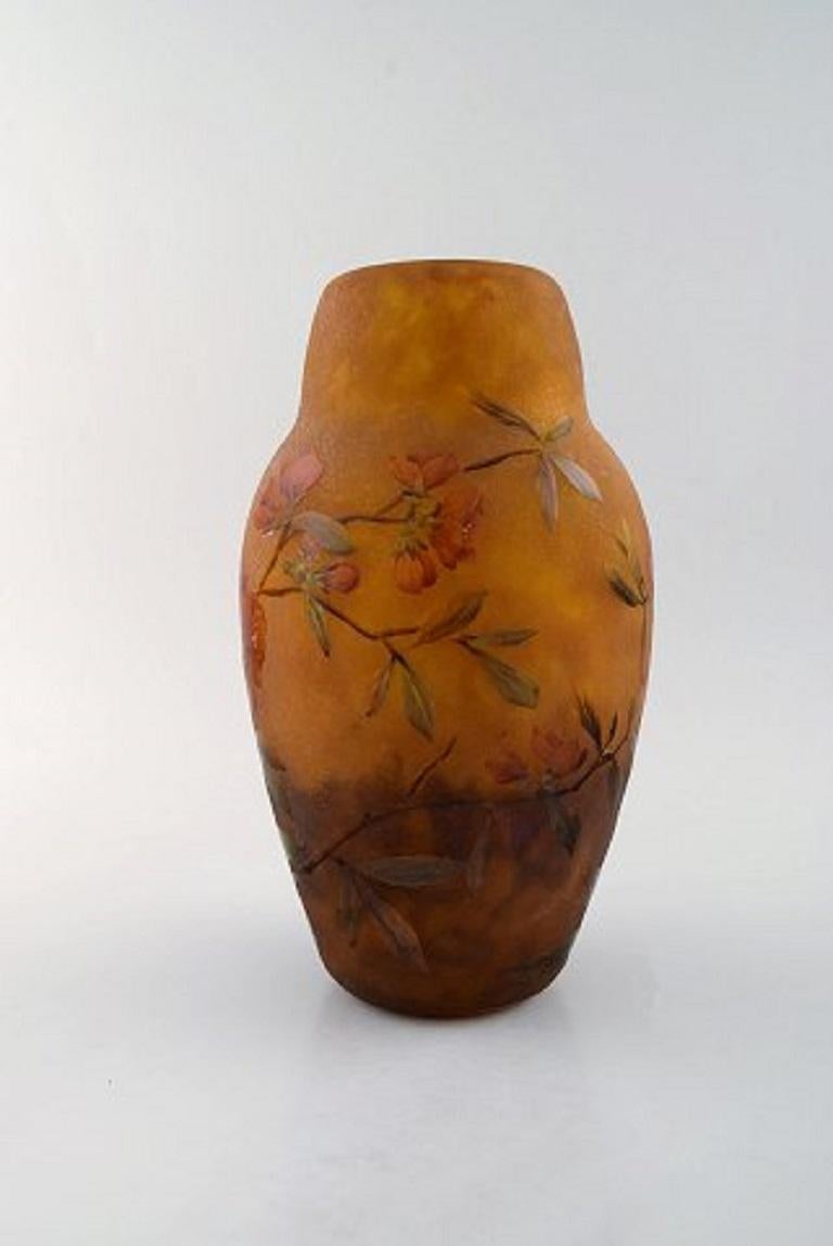 Large and impressive Daum Nancy Art Nouveau vase in mouth blown enameled art glass. Acid-etched glass. Hand painted red flowers and branches in relief. Dated 1915.
In very good condition.
Measures: 27.5 x 16 cm.
Signed with Lorraine cross.