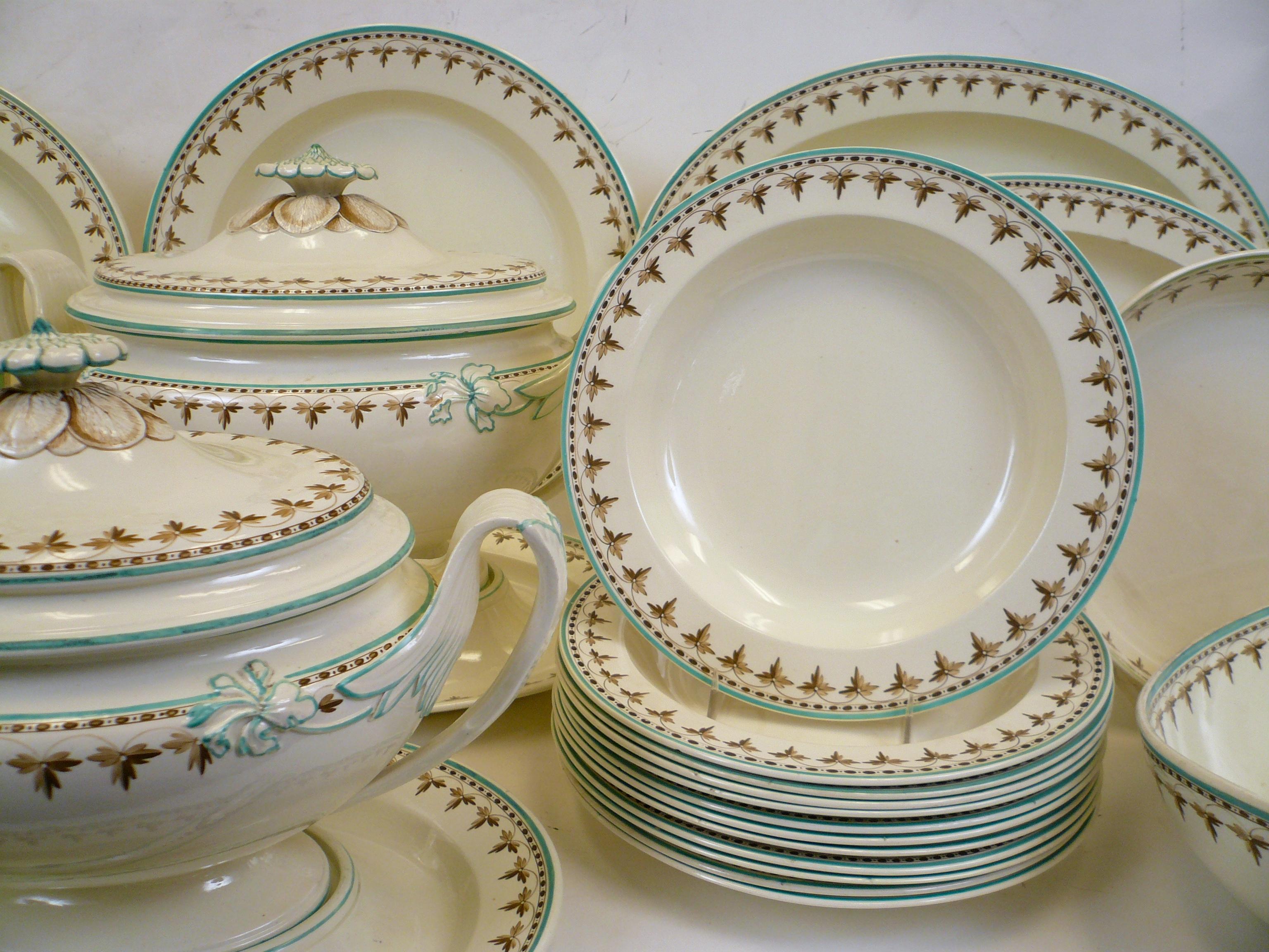 Creamware is a cream colored refined earthenware first produced in the mid-18th century, and perfected by Wedgwood in the 1760s. This dinner service with it's Classic Wedgwood shapes features acanthus leaf motifs and artichoke finials. It is