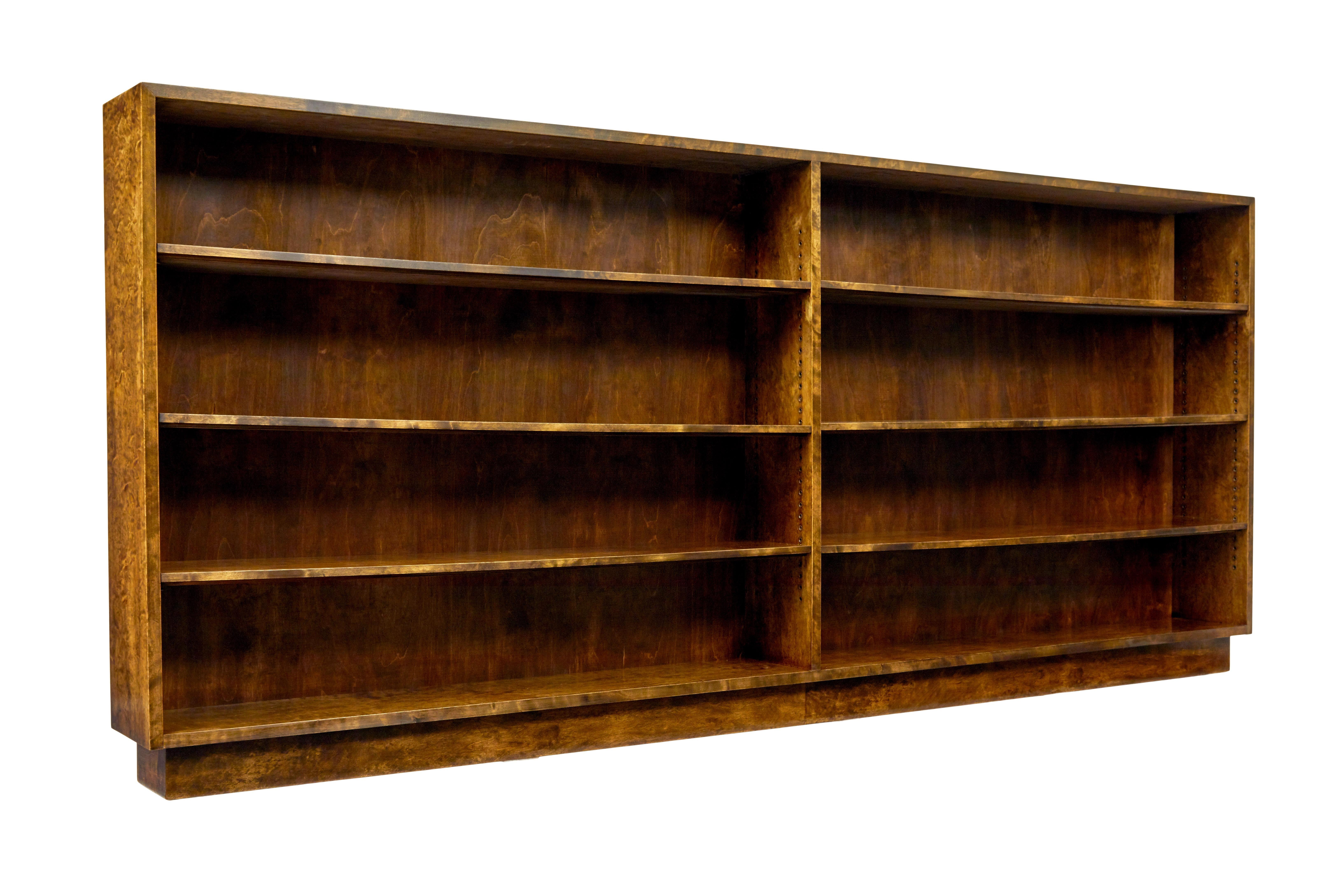 Large and impressive Swedish dark birch open bookcase circa 1950.

We are pleased to offer this bookcase of large proportions which measures at just over 9 feet long.

Just completely fully refurbished in our workshop which we retained its dark