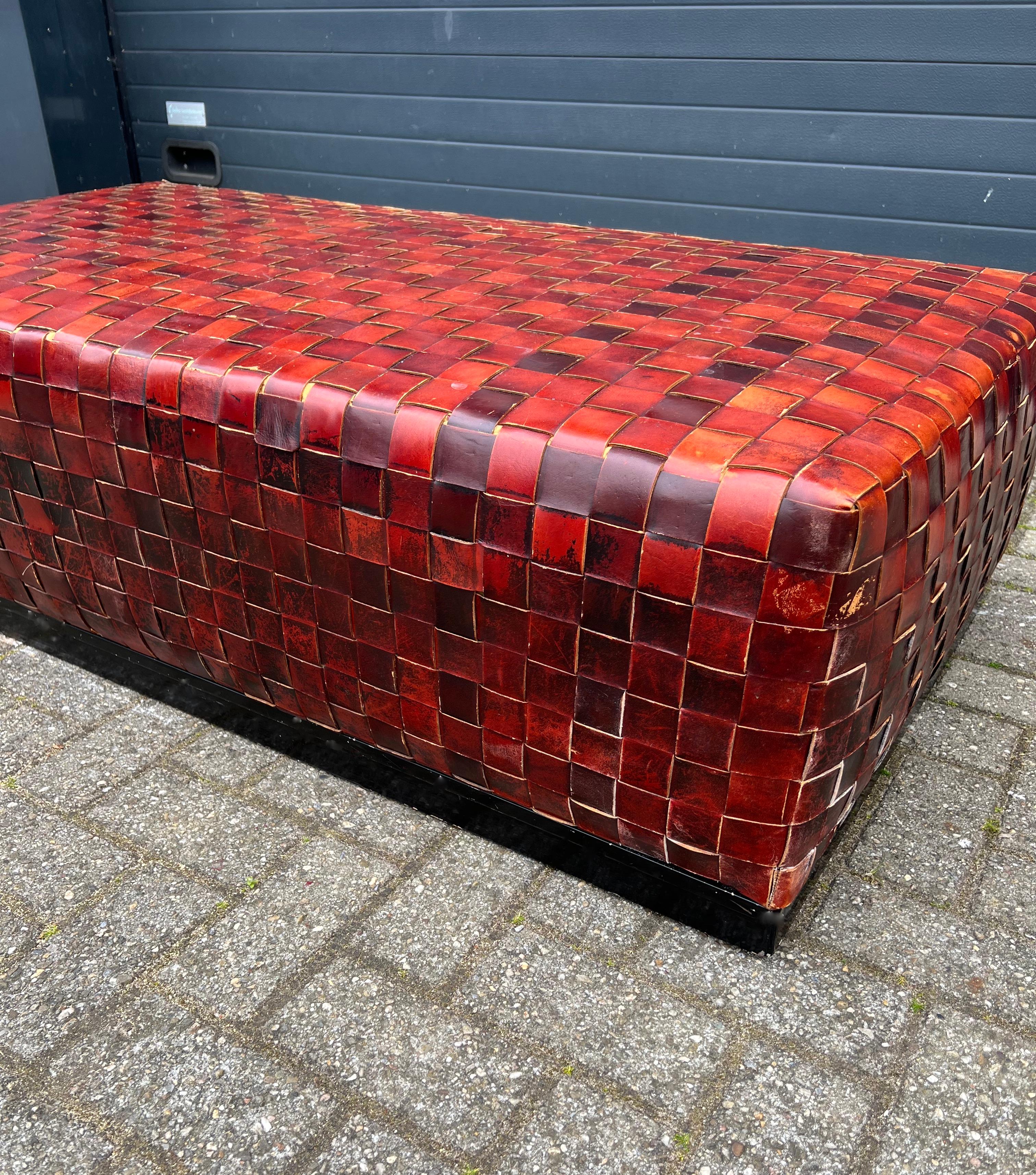 Timeless and stylish ottoman with top quality leather woven rails.

This finest quality and very large ottoman is another one of our recent great finds for interior designers and private collectors of stylish pieces alike. It will look great as a