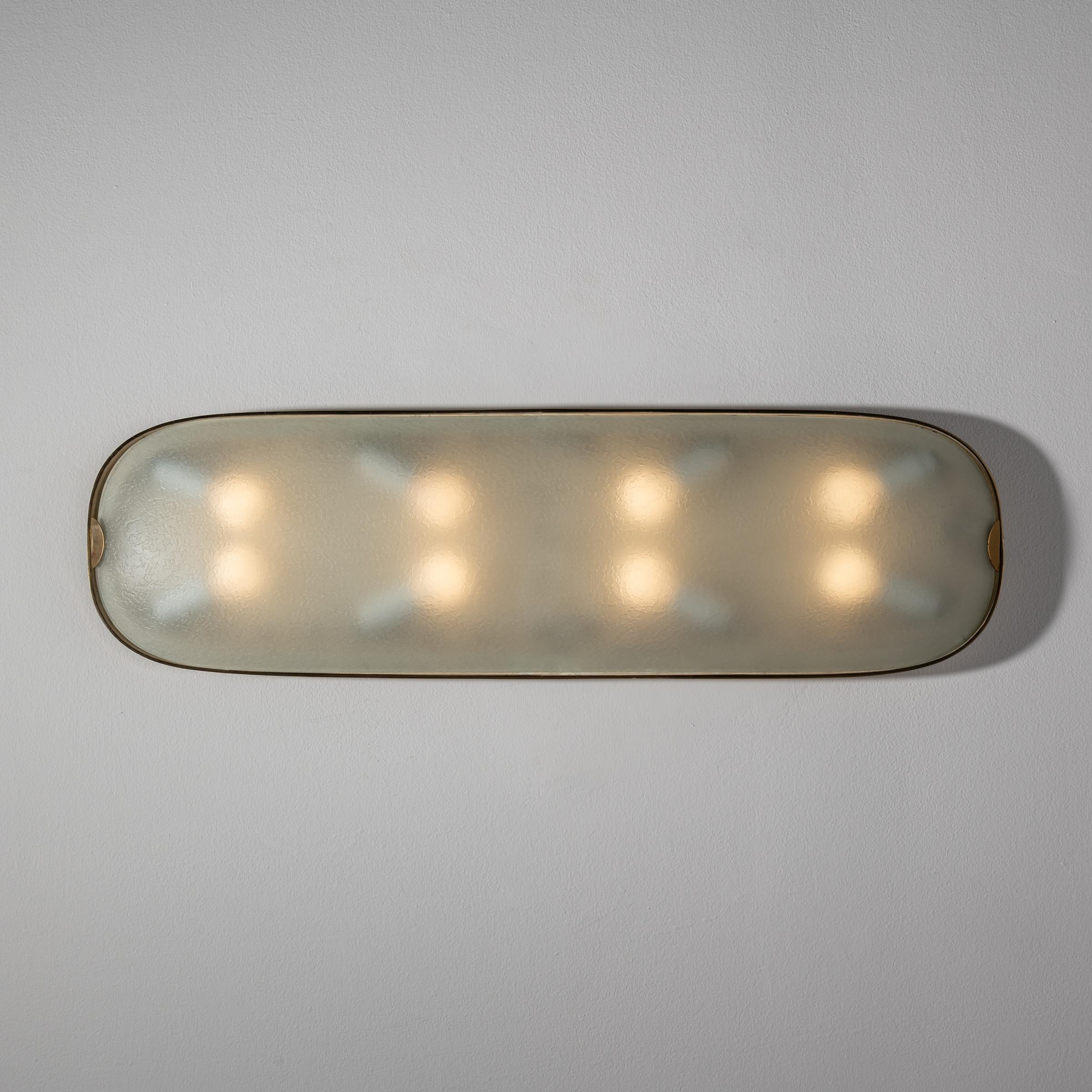 Large and rare flush mount wall/ceiling light by Fontana Arte. Designed and manufactured in Italy, circa 1950's. Wired for U.S. standards. 
We recommend Lamping: 120v 8Qty E14 Sockets 25w frosted bulbs, lightbulbs not included.