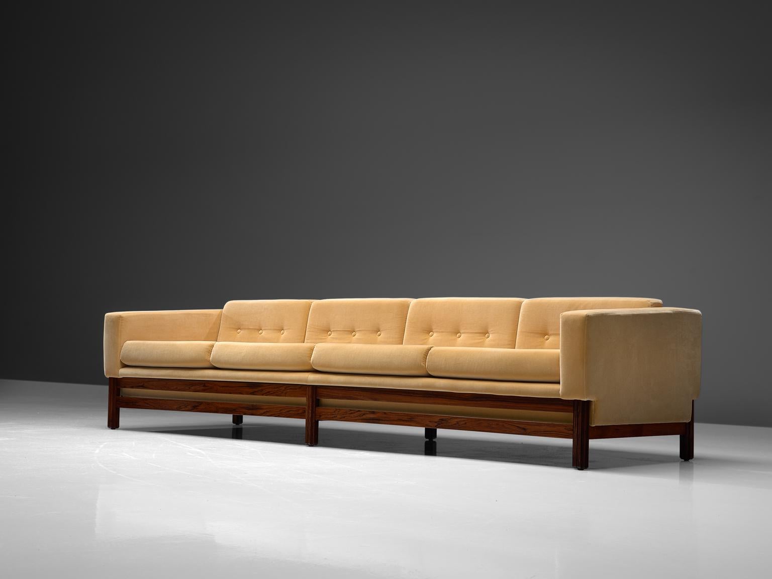 Sofa, in rosewood and fabric by Saporiti, Italy 1960s.

This sofa, equipped with a solid rosewood frame is reupholstered in high quality yellow velours like fabric. Done by our own team of specialists of the in-house atelier. The sofa is designed in