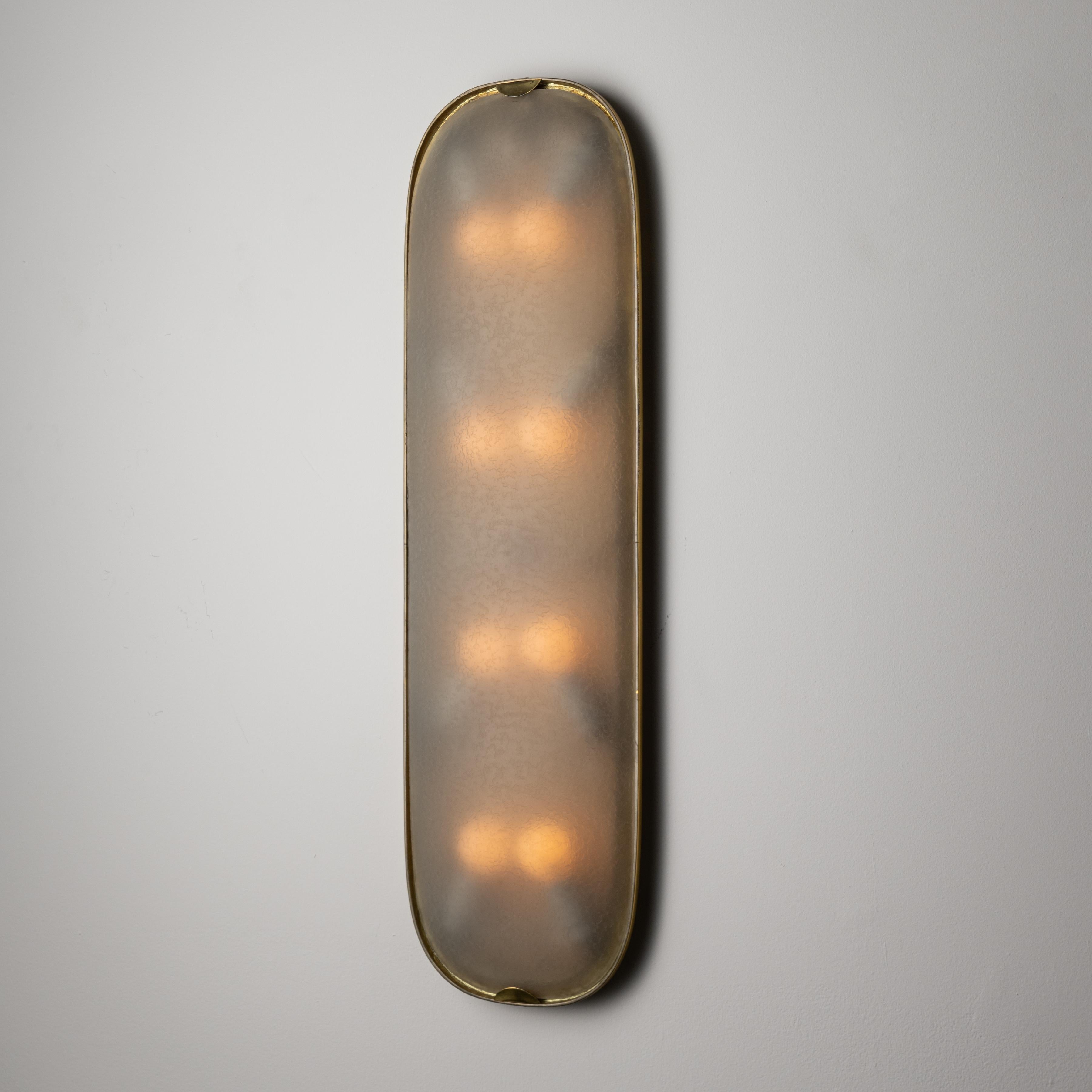 Large and rare wall/ceiling light by Fontana Arte. Designed and manufactured in Italy, circa 1950. Elegant flush mount with textured glass diffuser and a minimal brass frame. The flush mount holds eight E14 bulb sockets, adapted for the US. We