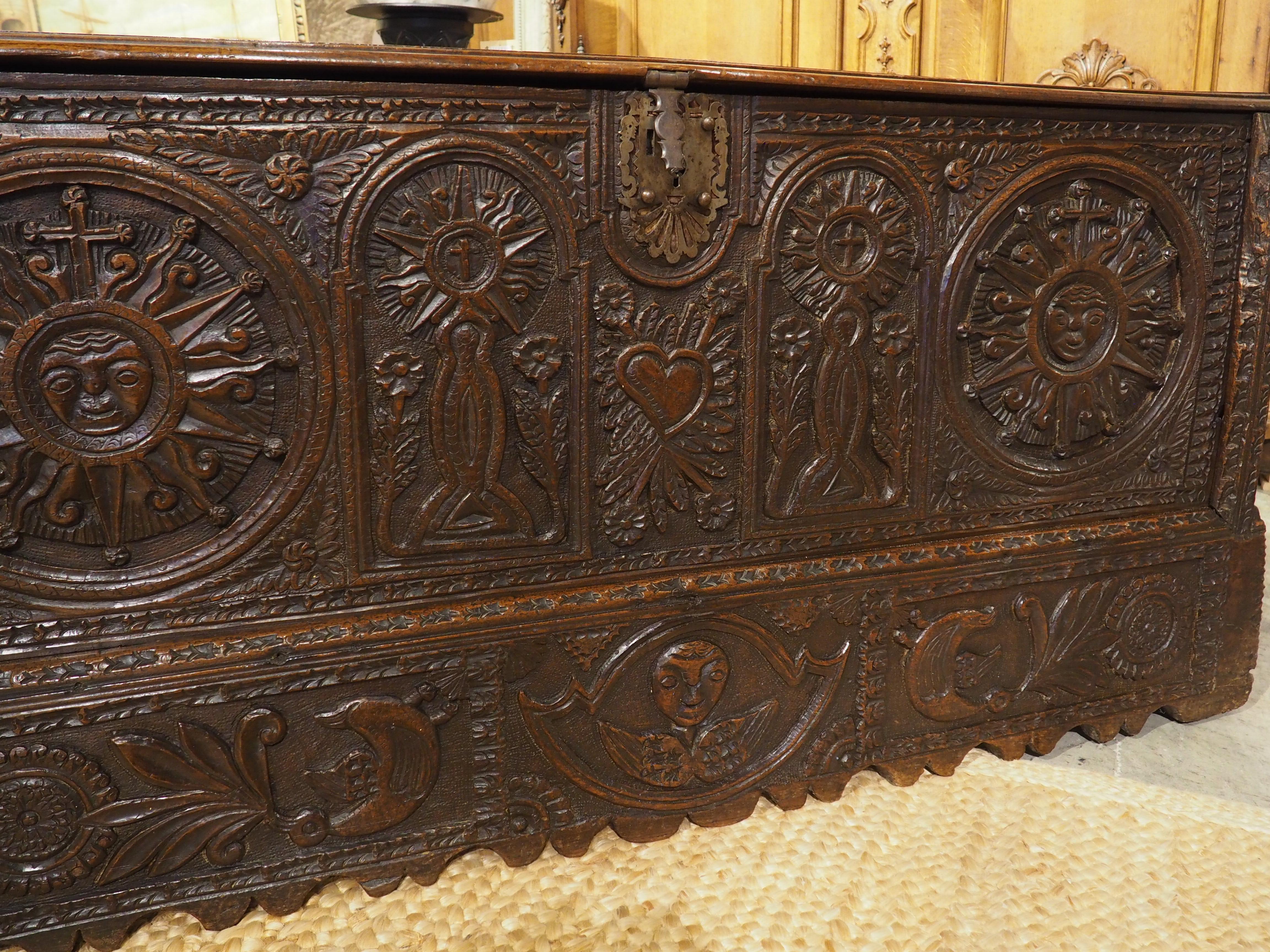 Metal Large and Richly Carved 17th Century Walnut and Oak Trunk from Spain For Sale