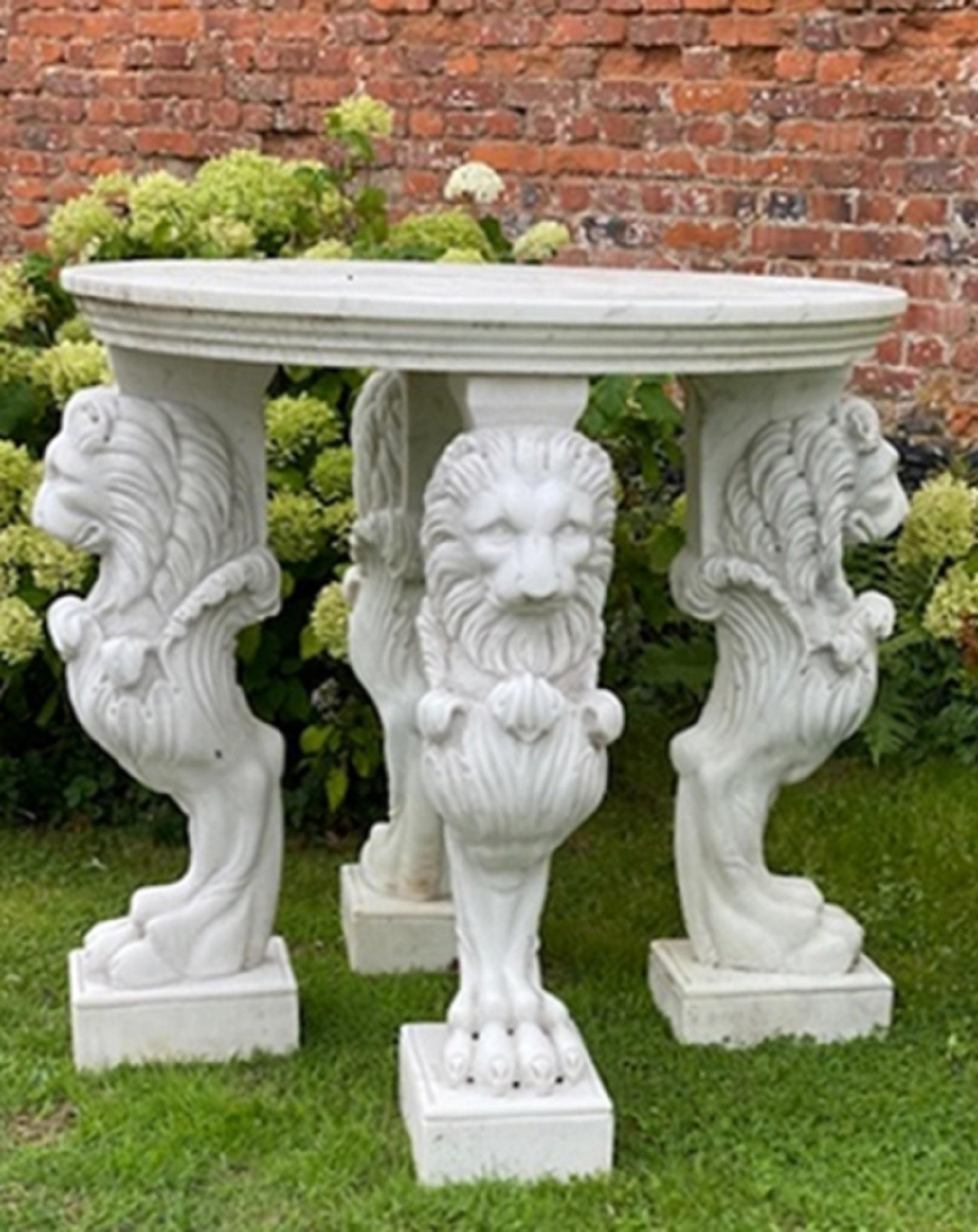Large and round marble table with feet in the shape of lions, Italy.