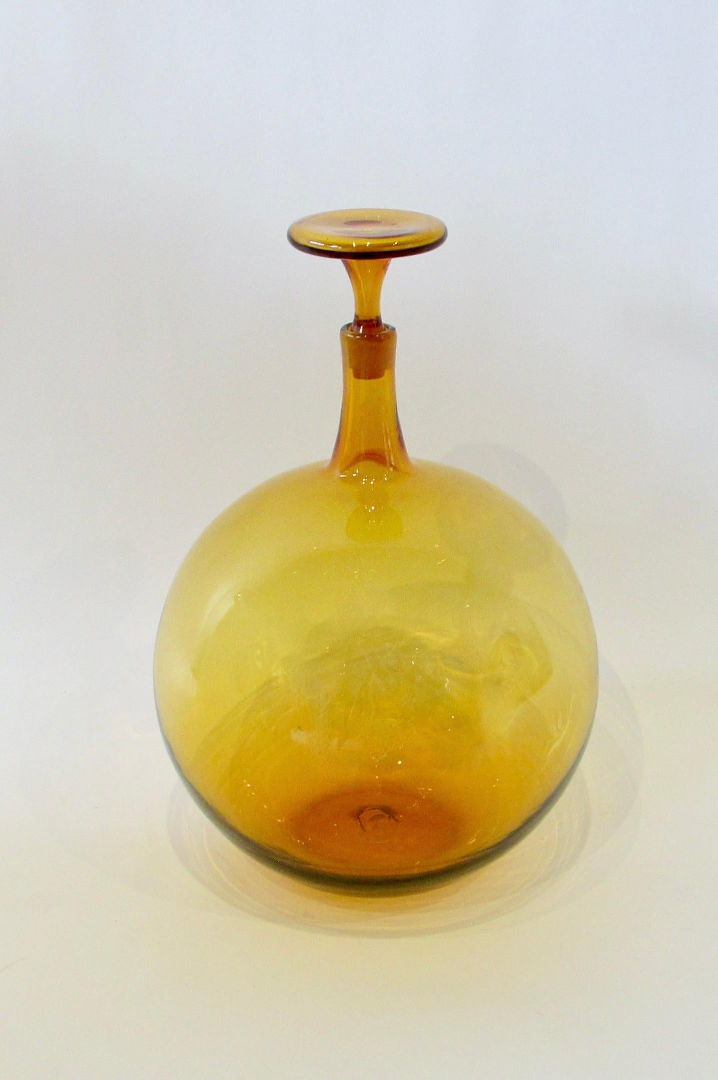 Large amber ball shape body bottle with stopper . Rare form I have never seen before . Bottle is 17.5