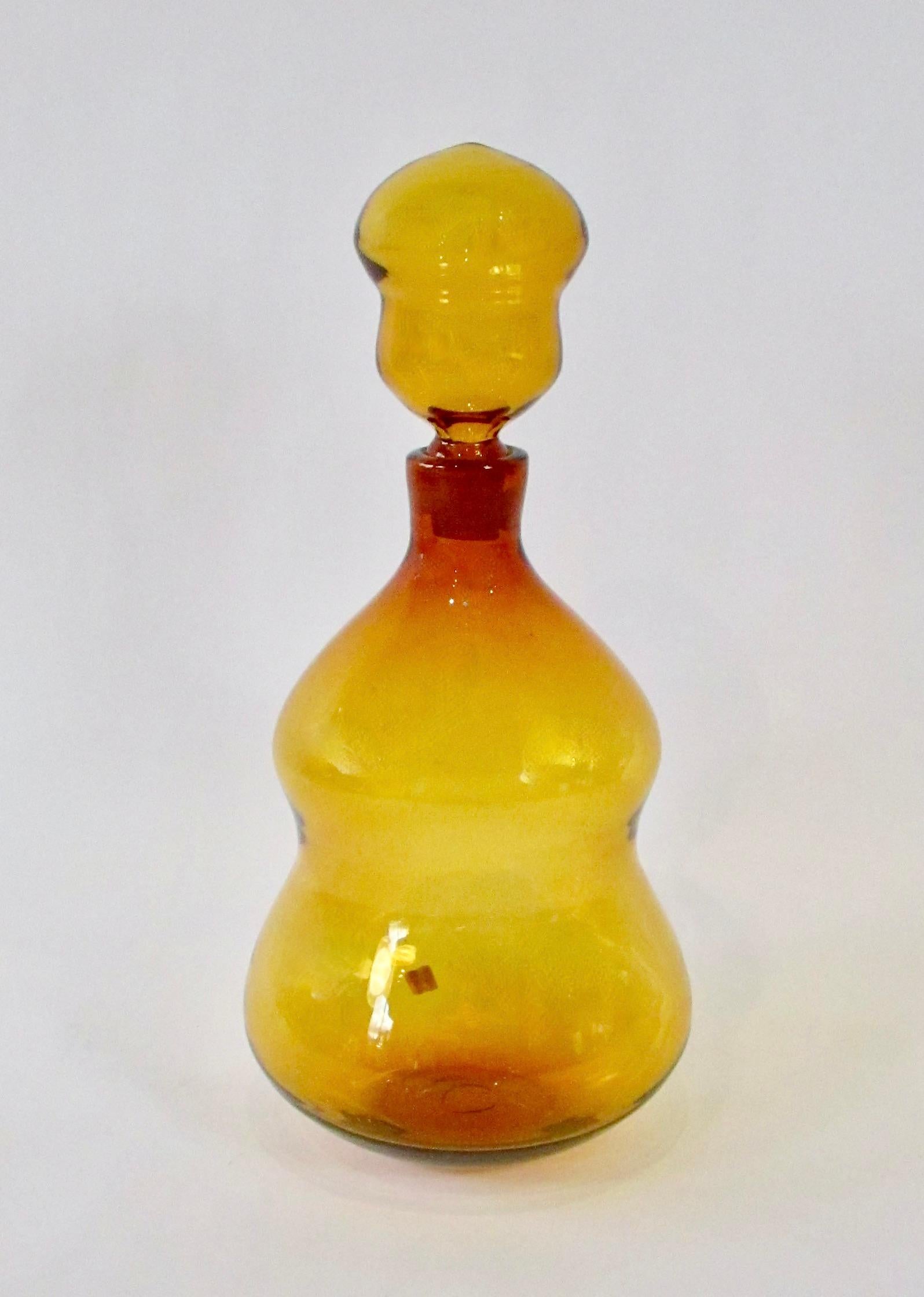 Large amber ribbed body bottle with stopper . Rare form I have never seen before . Bottle measures 17
