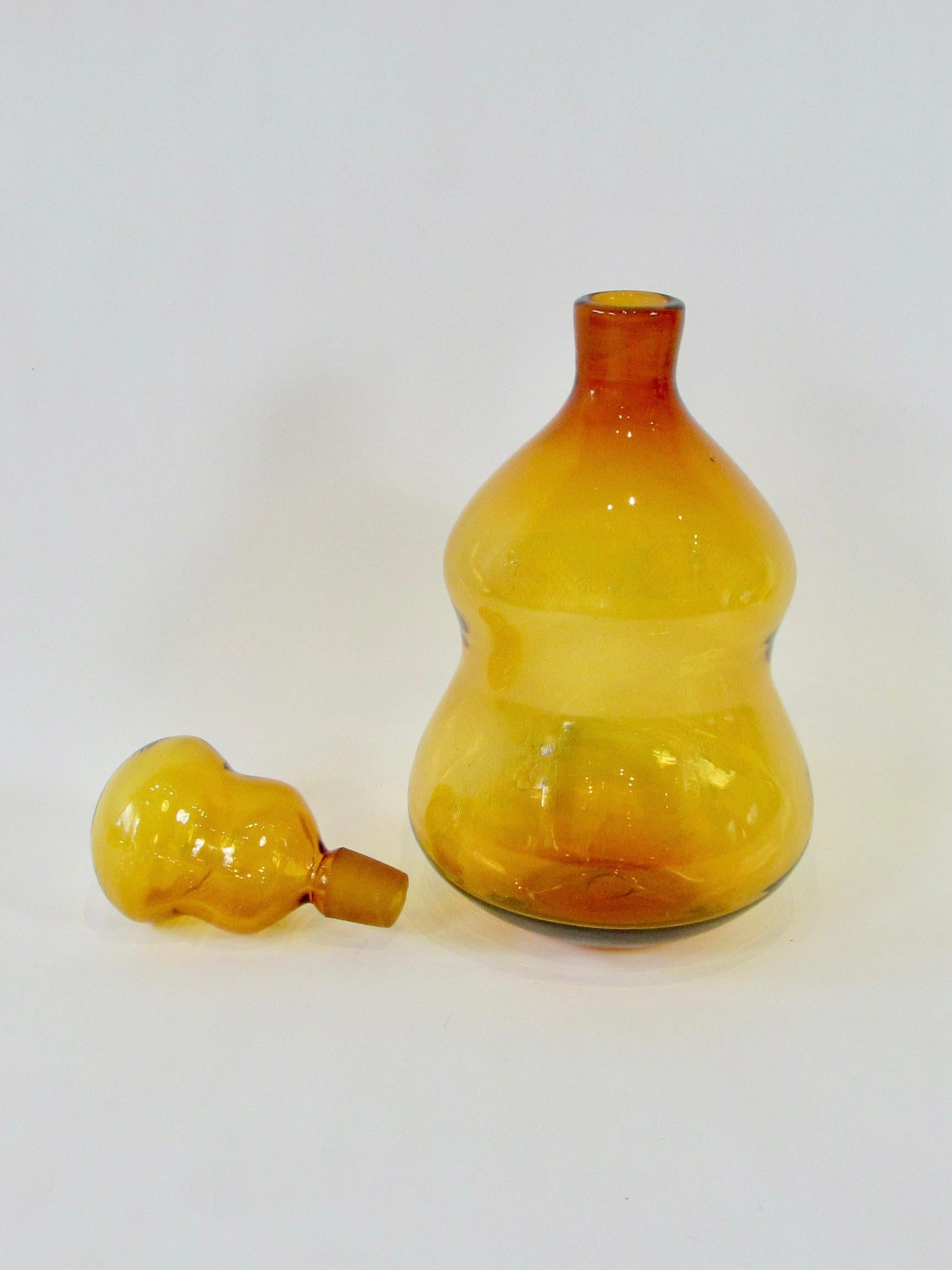 Glass Large and scarce amber tone Blenko bottle with stopper For Sale