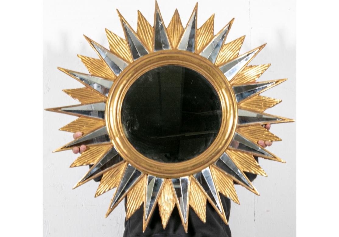 A rare, large and exceptional antique Sunburst mirror with a gilt and carved wood frame having inset mirror segments throughout. All original condition and dating to the early 20th century. 

Condition: Please see all detail photos. There are many