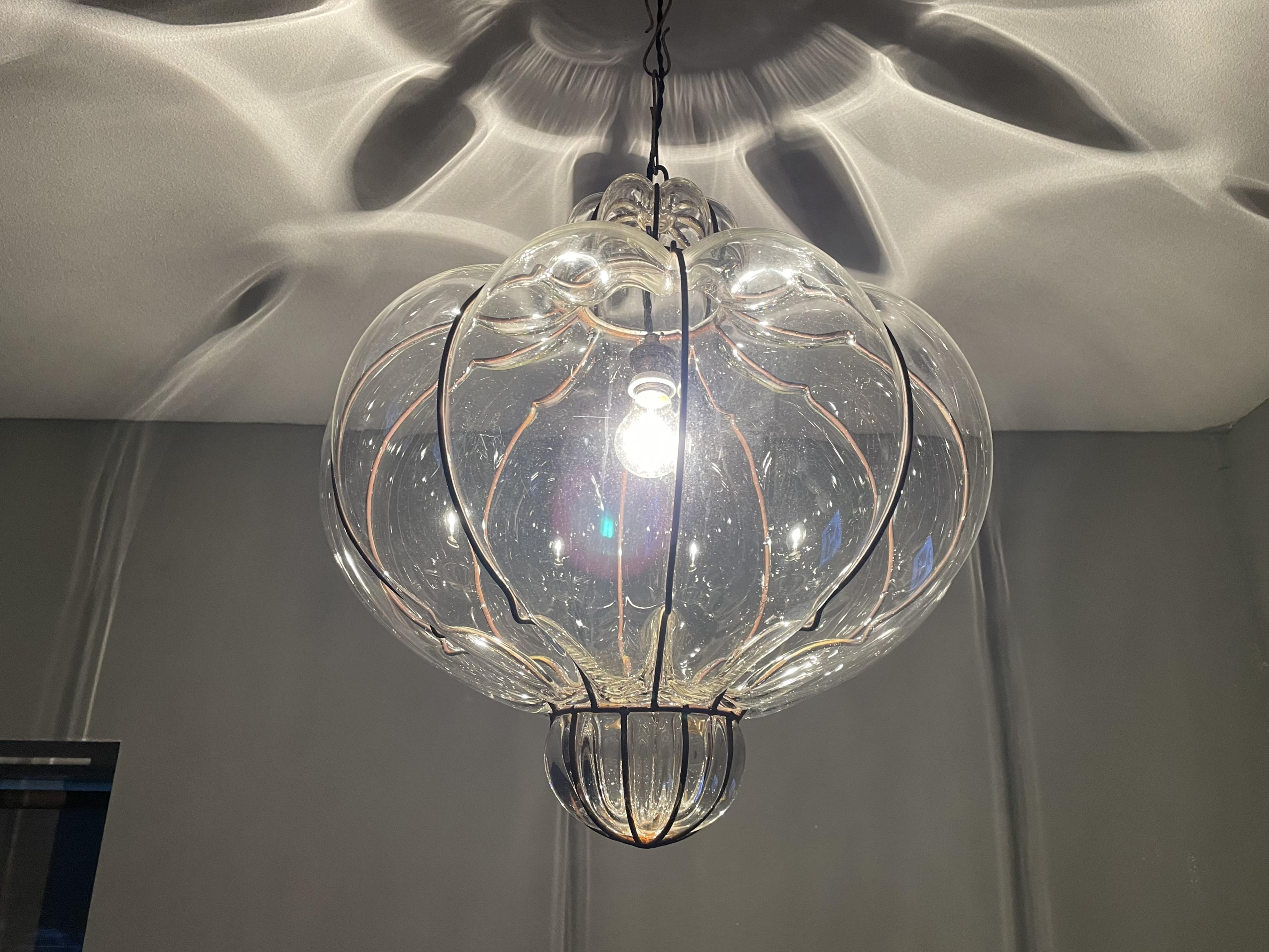 Stunning Midcentury made Italian transparent light fixture.

This fine quality workmanship pendant from mid-20th century Italy is another one of our recent great finds. Last year we came across his twin brother (jn terms of size and style) and we