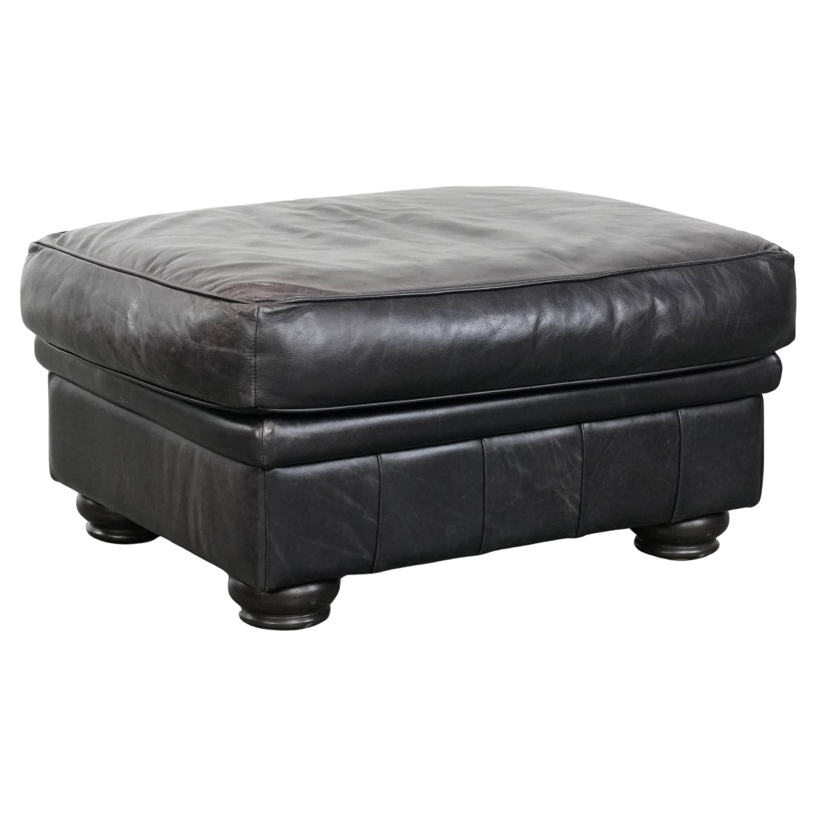 Large and timeless black ottoman made of cowhide leather in English style For Sale
