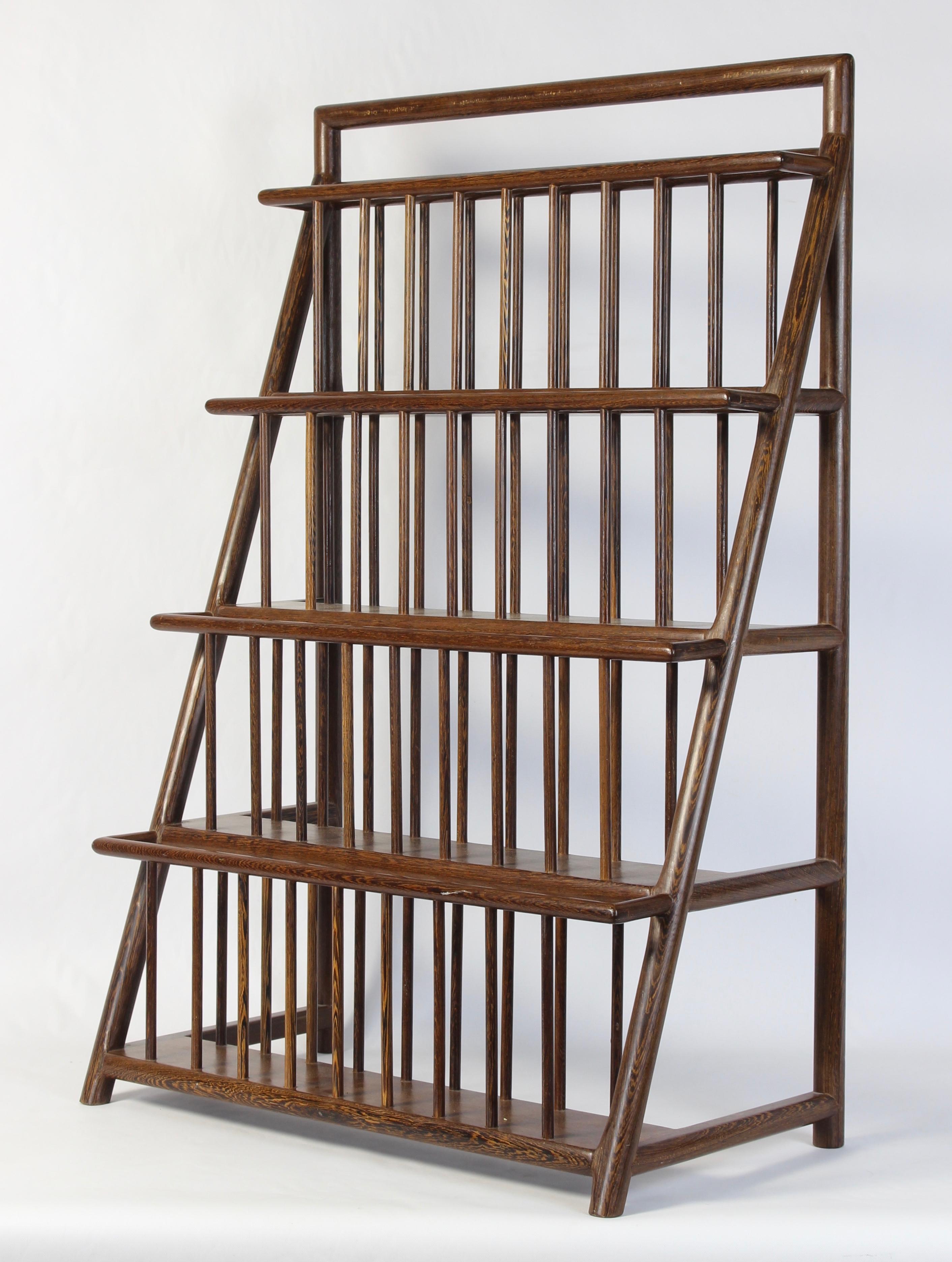 A very unusual and exceptionally well constructed large scale mid-20th century. magazine rack with joinery reflecting Japanese methods fashioned from what appears to be wenge wood.