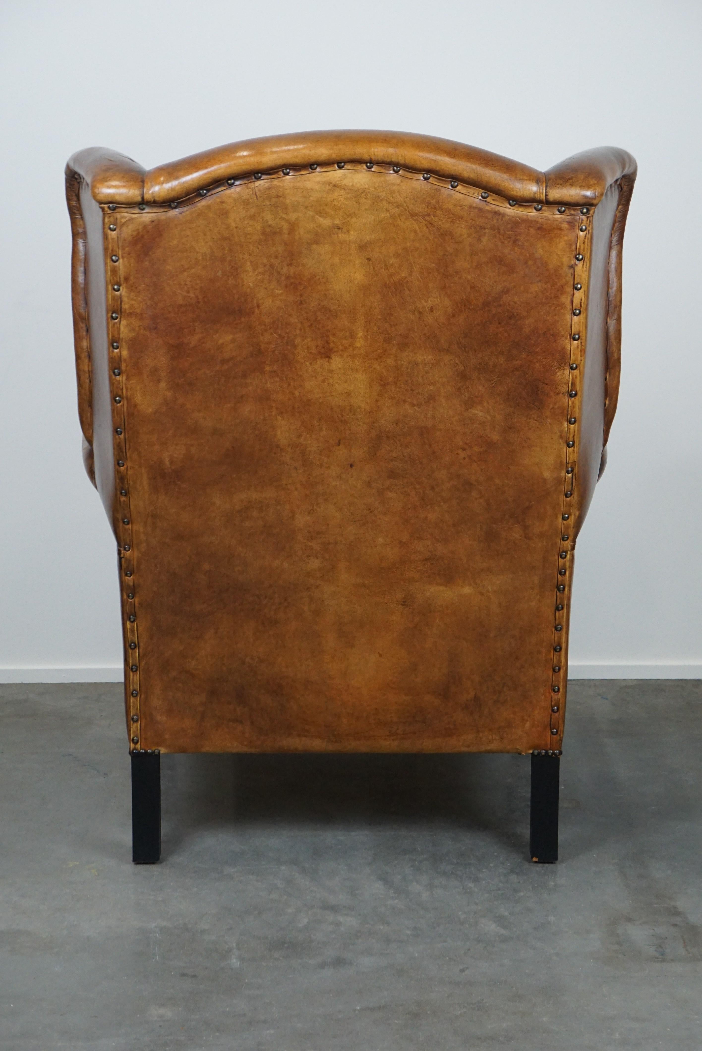 Large and very comfortable wingback armchair made of sheep leather In Good Condition For Sale In Harderwijk, NL