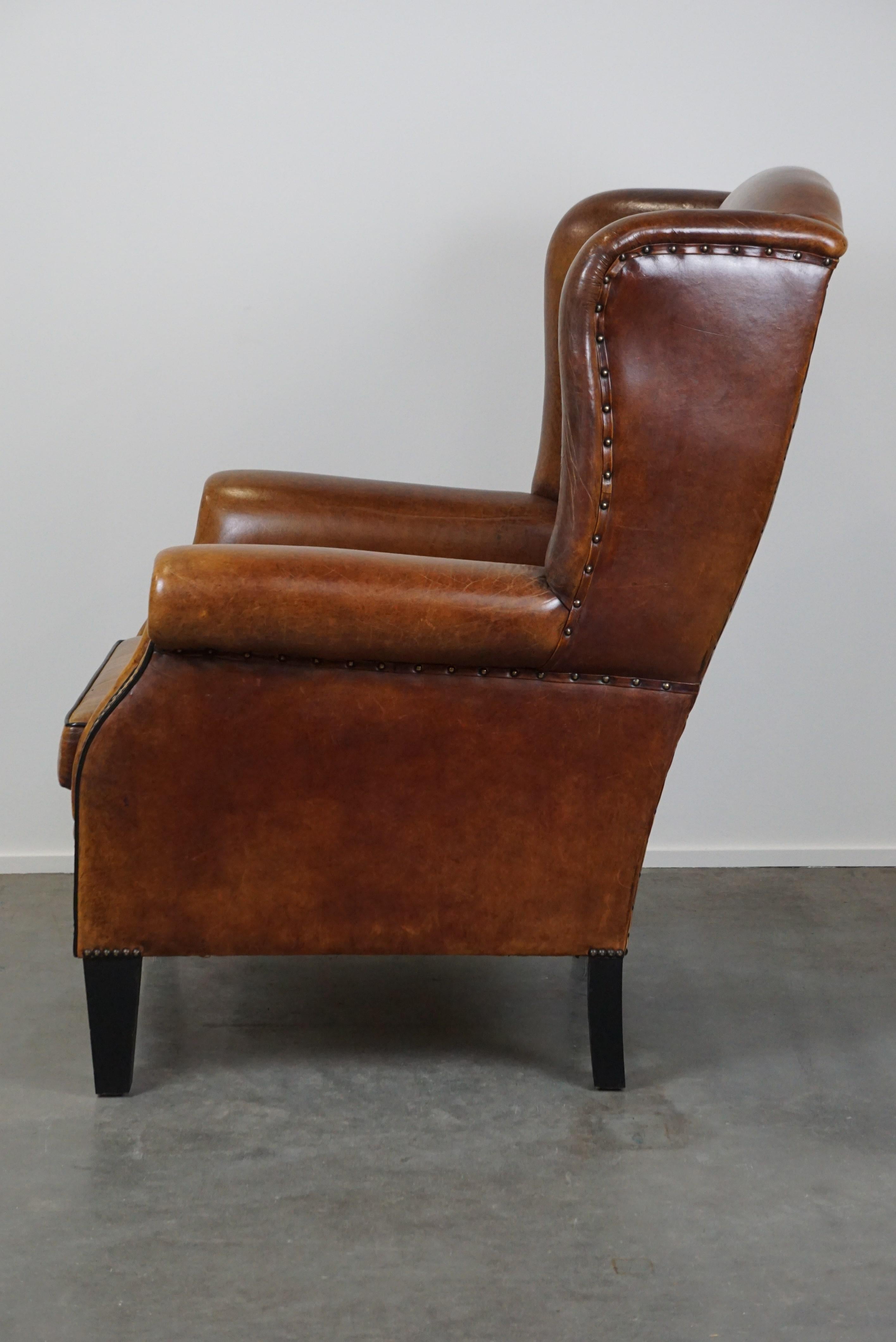 Late 20th Century Large and very comfortable wingback armchair made of sheep leather For Sale